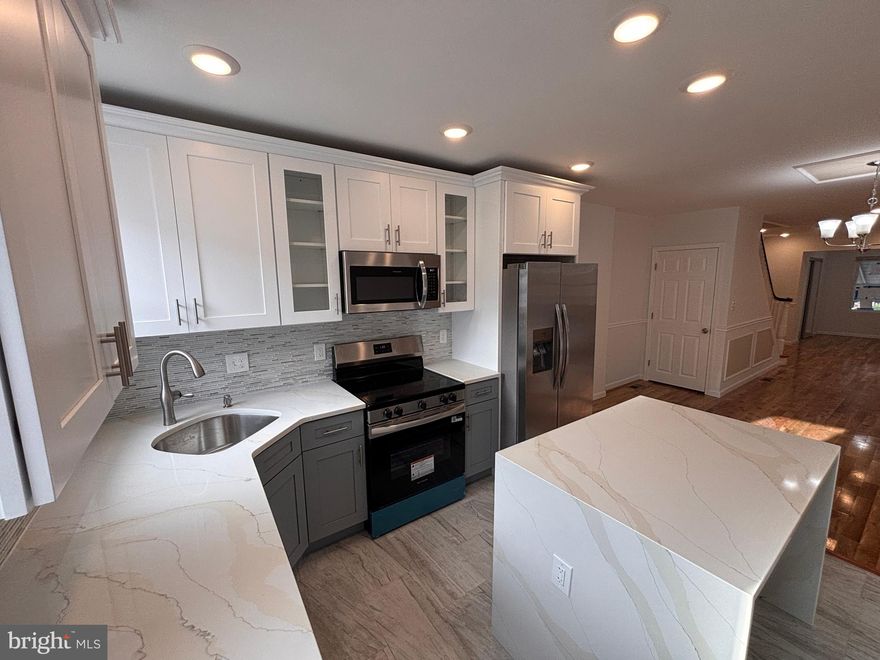 Move right in! This FOR SALE house is conveniently located in a quite West Oak Lane. This large 4 bedrooms 3 full bath bathrooms home is fully remodeled with elegance and comfort in mind. Open concept layout living and dining area with new hard wood flooring thru out the house, chair and base molding and recessed lighting. Living room also features one of a kind fireplace that is a statement piece. Beautiful chandelier completes a spacious dining room. The kitchen features brand new cabinets with state-of-the-art self-closing doors, quartz countertop, sleek backsplash, and all stainless-steel appliances.  The upstairs offers a master bedroom with on suite bathroom and very large closet; there are two additional bedrooms with plenty of closet space. Second floor also features a European spa like bathroom with imported vanity and elegant tile. No detail was overlooked. The finished basement boasts plenty of open space for entertaining and new carpet. Downstairs also features another spacious bedroom and full bath That's not all, this home features brand new HVAC, electric, plumbing, all permits have been pulled, and all inspections have been passed. Owner is a licensed real estate agent.