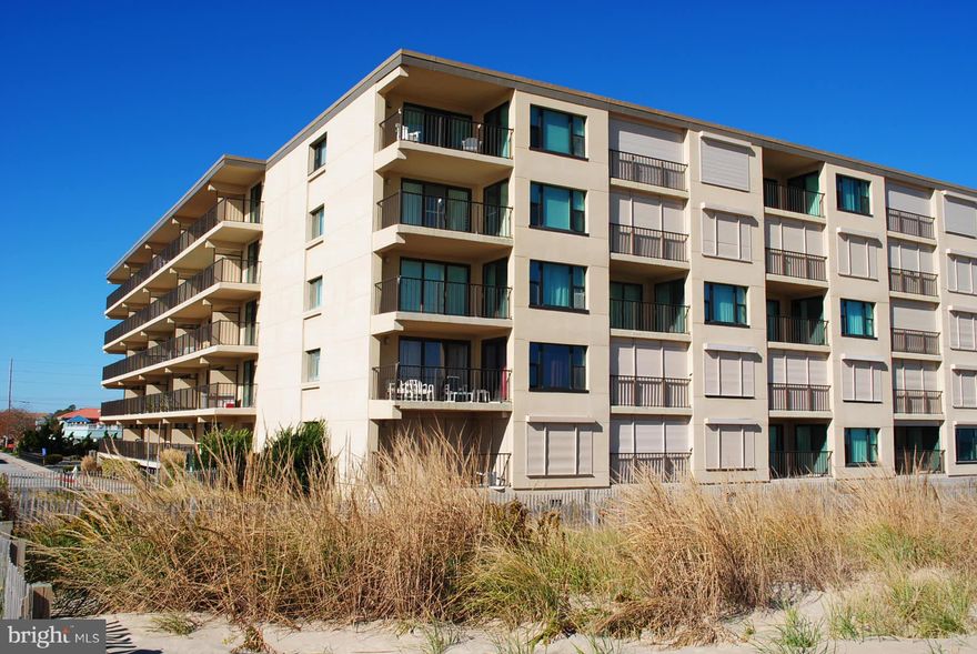Great views from this first floor unit in masonry building located in North Ocean City, MD near the Delaware line.  Easy access from parking lot up ramp to walkway and  into well maintained unit.  Not a rental and it shows.  Heavy duty drapes recently installed.  Nice size balcony for relaxing and listening to the waves of the water brushing against the sandy beach.  Or, take a walk with coffee in hand through the dune path and appreciate the beautiful morning sunrise.  Just 100 one, two and three bedroom units in this building.  Beautiful outdoor pool for refreshing swims after a hard day at the beach.  One assigned parking space and plenty more available.  Condominium fees are $2,296 per year.  County, state and city taxes total $3,172 per year. Quarterly waste water bill is $106.95 totaling $427.80 yearly.  Ocean Place is undergoing a $2.7 million renovation project over the next two years. The building will look new again! Owner assessment for this unit will be about $19,000, which will be paid by the seller. Don't miss this opportunity.