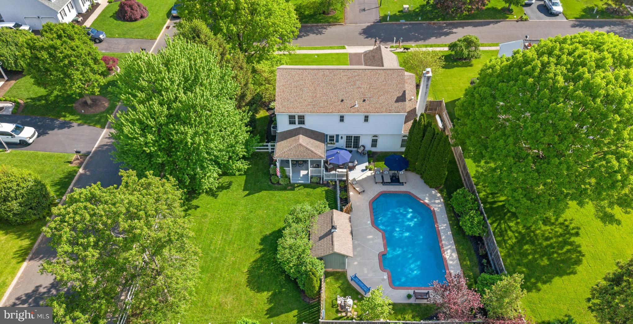 Welcome to 3970 Sherwood Lane, a charming and well-appointed home nestled in the heart of Buckingham. This delightful home offers 4 spacious bedrooms and 2.5 bathrooms with an in-ground pool and fabulous backyard. As you step inside, you're greeted by the warmth of hardwood floors that grace most of the first floor. At the heart of the home lies the kitchen, boasting granite countertops, stainless steel appliances, and a center island perfect for casual dining or culinary adventures. The open-concept kitchen and breakfast area flow seamlessly into the family room, where you'll find a stunning brick fireplace—a cozy gathering spot for chilly evenings. Sliding glass doors lead from the breakfast area to the rear deck and pool area, offering the ideal backdrop for summer barbecues and poolside relaxation.
Host dinner parties in the dining room, complete with a built-in bar featuring a wine refrigerator and cabinet lighting. Another set of sliding glass doors opens to the covered, extended deck, perfect for entertaining family and friends. The sun-filled living room features new carpet, sophisticated shadowboxing, moldings, and a beautiful bay window. Finishing off the first floor is a convenient half bath and a laundry room with access to both the backyard and the 2-car garage. Upstairs, discover the oversized primary bedroom suite featuring a large sitting area, a vanity area for starting your day, a spacious walk-in closet, and the primary bathroom with a double sink vanity and a glass-enclosed shower. Three additional well-appointed bedrooms share the hall bath. Noteworthy features include hardwood floors in one bedroom and an oversized closet in another.
The partially finished basement provides versatile space, perfect as a workout room, gaming space, or play area, along with ample storage for all your extras. The backyard is a true summer haven with its fenced yard, in-ground pool, pool house, and a large deck that offers both sun-soaked and covered areas for relaxation and play.
Situated on a generous corner lot, this home also offers the convenience of a school bus-friendly location. Modern updates such as new garage doors, windows, a newer roof and gutters, as well as a new well pump and heat pump, provide peace of mind. Don't miss the chance to call this wonderful home your own!