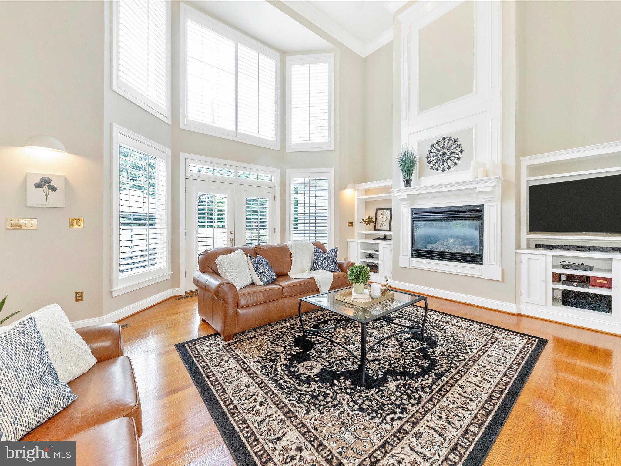 Welcome to 16013 Pheasant Ridge Court — a beautifully maintained, spacious home set on three private acres in sought-after Woodbine, Maryland, within the award-winning Glenelg High School district. With over 3,400 finished square feet, this 4-bedroom, 4.5-bath property offers the perfect balance of luxury and functionality. Southern Living in the Heart of Howard County Horse Country! From the brick-to-grade exterior and gracious front porch to the recently repainted interior, this home exudes warmth, quality, and attention to detail.
The main level features gleaming hardwood floors, 9-ft ceilings, and a dramatic two-story family room filled with natural light. The main-level primary suite is a true sanctuary, boasting a fully renovated luxury bathroom with a modern soaking tub, frameless glass shower, granite countertops, water closet, and stunning gold faucets and finishes.
The heart of the home is the bright and cheery kitchen, featuring granite countertops, stainless steel appliances, glass-front cabinetry, a kitchen island with cooktop, and a spacious eat-in area perfect for casual dining and entertaining.
Downstairs, enjoy movie nights in your own theater room, with plenty of room for relaxation and recreation. The walk-out basement also offers ample storage space and direct access to the outdoor patio, which is ideal for enjoying peaceful views or hosting gatherings.
With 4 bedrooms, 3.5 baths, a rear staircase, and generous living areas throughout, this home blends timeless elegance with modern upgrades—all located just minutes from major routes Conveniently located just minutes from commuter routes, shopping, and dining—yet tucked away in a quiet community with no HOA. Zoned for Triadelphia Ridge ES, Folly Quarter MS, and Glenelg HS — some of the most desirable schools in Howard County.