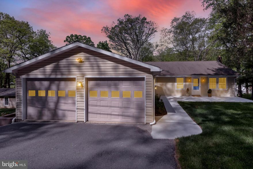 Nestled in a tranquil countryside setting, this ranch-style home is a great place to relax surrounded by trees. Step inside to discover new floors, fresh paint, and a renovated bathroom. Having bedrooms on the main floor is a great bonus, mainly because they are close to the kitchen! The lower level has also been updated and boasts a second kitchen and laundry; two rooms have closets- what a great in-law suite. There's even a new pellet stove. It also offers outside access to the beautiful, well-planned backyard- a fantastic place for a picnic! Bring your green thumb because there's a garden shed and planting area. With an attached and detached garage, your storage solutions are as versatile as your lifestyle needs.