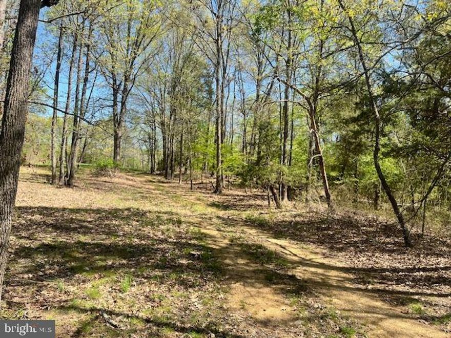 The house located on the property cannot be used as a residence (Heavy Industrial zoning) and is  uninhabitable for any other use in current condition and not to be entered.    - Enter thru the Visitor Center driveway which is an easement to get to the gate entry for the property.