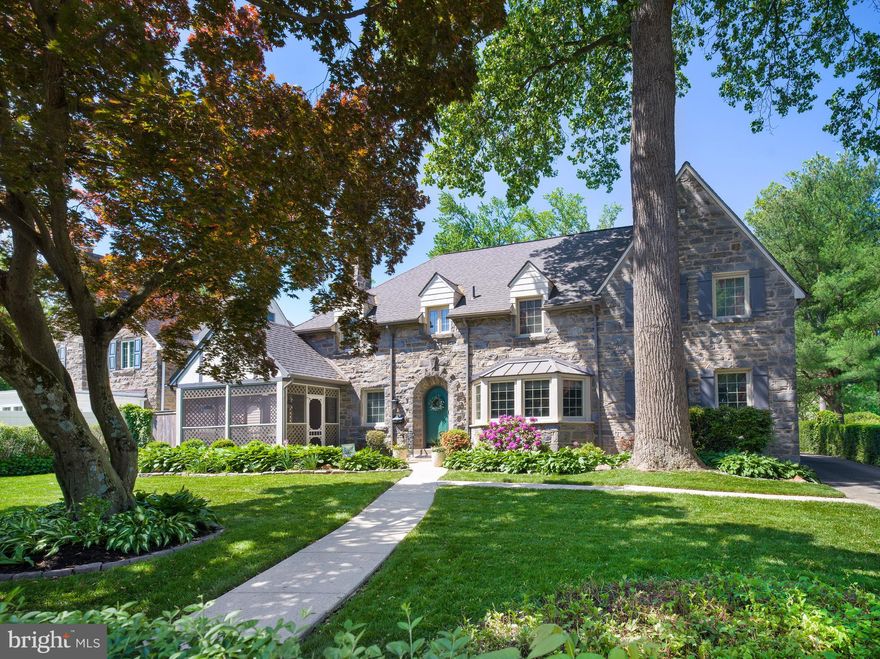 Welcome to 1204 Drexel Avenue, a distinguished stone Tudor that blends timeless architecture with modern amenities in the heart of Drexel Hill. This elegant 4-bedroom, 3.5-bath home offers exceptional space, character, and convenience for today’s lifestyle. Step inside to find rich hardwood floors, arched doorways, and a gracious layout featuring a formal living room with a gas fireplace and stone surround with access a charming screened-in porch, perfect for relaxing or entertaining from early spring through late fall. A spacious sunlit dining room features a beautiful bay window overlooking the manicured front yard and features classic details such as wainscoting and crown molding. The updated kitchen with center island provides a perfect workspace for all meals and a conveniently located breakfast room just off of the kitchen-the perfect location for more informal meals. The adjoining family room is a welcome spot to relax and enjoy time with friends. For extra convenience, a full bath is located just off of the family room.  A powder room and laundry room are also located on this level of the home.  Upstairs, four generously sized bedrooms, including a serene primary suite with a private bath.  The primary suite is very spacious and offers room for a small sitting area in addition to a generously sized walk-in closet. The primary bath features his and her vanity as well as a shower with jetted tub.  The remaining three bedrooms on this level all feature hardwood floors, bathed in sunlight and are very comfortable in size.  The hall bath with tub/ shower is nicely suited.  The third floor is fully finished, offering a playroom, craft room, two closets, and a walk-in attic for even more flexibility and storage. The finished basement offers even more living space, storage, and additional laundry hook-up. Plenty of room in this area to have another family room, workout area, home office and more.  Enjoy summer days in your private backyard oasis with a sparkling swimming pool along with a spacious and carefree deck overlooking the inviting pool. All of this and easy access to transportation, shops, dining and so much more. Classic charm, versatile space, and thoughtful updates make this home a true standout. Don’t miss the opportunity to own a piece of Drexel Hill history with all the comforts of modern living.