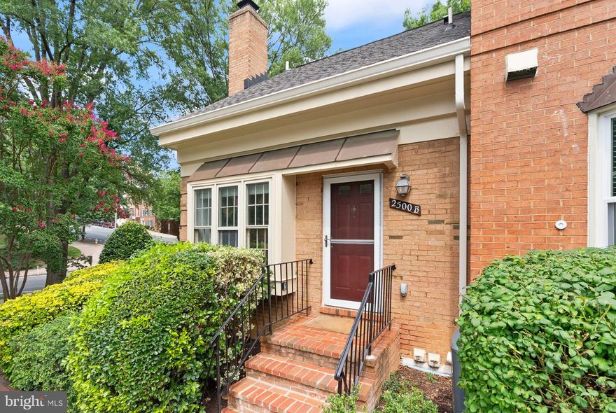 Welcome to Barton Place—a hidden gem tucked in the vibrant Clarendon-Courthouse neighborhood!
This two-level, 2-bedroom, 2-bathroom end-unit condo townhome offers the perfect blend of comfort, modern updates, and an unbeatable location—just steps to the Metro, top restaurants, and local amenities.

The main level features an open-concept living and dining area with brand-new flooring, a cozy wood-burning fireplace, and a bright bay window with western exposure. The recessed lighting and coffered ceiling add both character & functionality to the space. The updated kitchen features a spacious peninsula that maximizes counter & storage space, stainless steel appliances, and a generous pantry tucked beneath the stairs provides even more storage. A main-level bedroom and full bath offer flexibility for guests, a home office, or single-level living.

Upstairs, the primary suite boasts vaulted ceilings, an updated en-suite bathroom, and access to a private deck overlooking Rocky Run Park—perfect for morning coffee or dining al fresco. This level also includes a laundry room, access to an unfinished storage area, and stylish touches like skylights & ceiling fans. Major upgrades include new flooring (2025), fresh paint (2025), and HVAC (2021).

Enjoy the convenience of two parking spaces and exceptional walkability—just steps from Whole Foods, Lifetime Fitness, Starbucks, and a variety of shops. Walking distance to both Clarendon and Courthouse Metro stations, and directly across from Rocky Run Park, with top-rated dining and nightlife all around.

This home offers the ideal combination of low-maintenance living and urban lifestyle in one of Arlington’s most sought-after locations. Come see it for yourself!