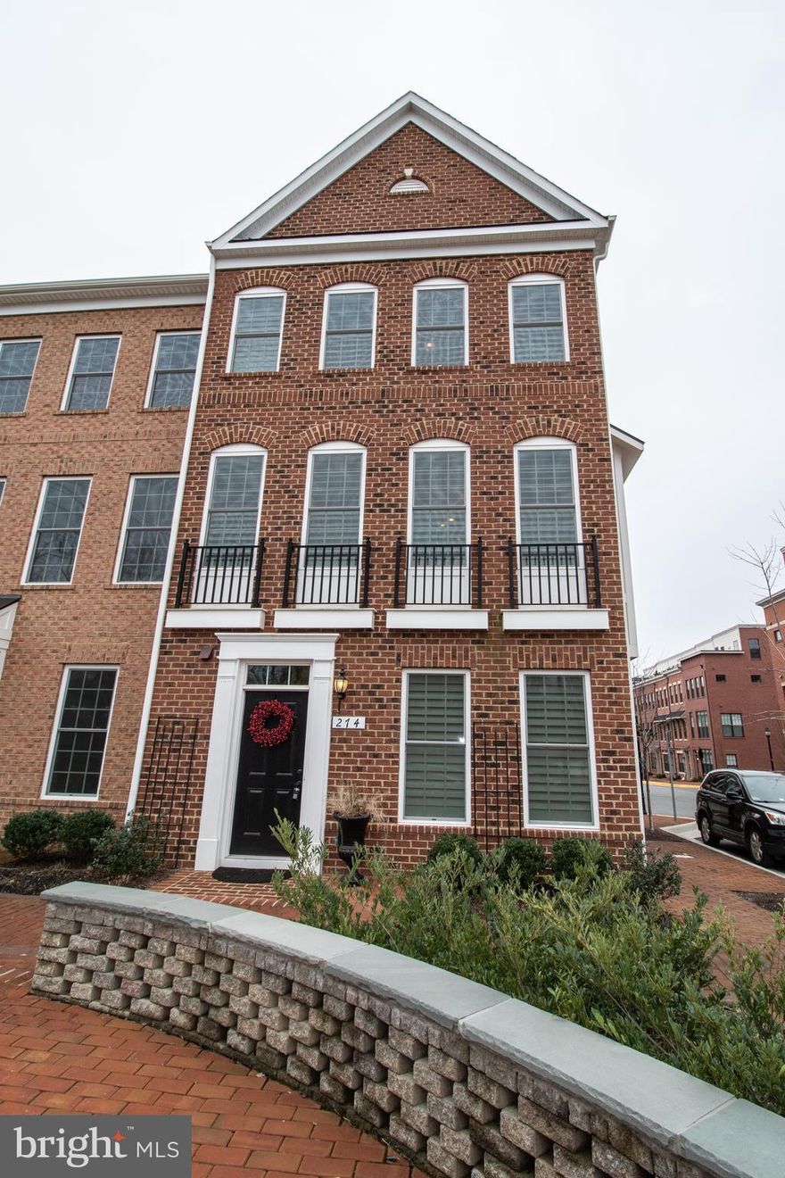 Beautiful & sought after Douglas Model in Downtown Leesburg! Move In Ready!! Walking Distance to Downtown Leesburg, W&OD Trail, shopping, phenomenal restaurants, and exciting night life all just steps away. Enjoy the ability to walk to all of the town events, First Fridays, Holiday parades, and so much more. This sought after end unit 4 level townhouse has everything you could want & need. Custom plantation shutters, brick accent walls, in ceiling speakers, the list goes on & on!  Walk in & be greeted by gleaming wide plank engineered hardwoods which stretch throughout the entire lower & main level. Lower level holds a vast & bright recreation room with half bath & access to the 2 car garage including epoxy floors. Continue to the main level with huge eat-in kitchen with butler's pantry, over-sized island with room for bar-stools, and plenty of natural light. Gourmet kitchen holds stainless steel appliances, island, gas cooking & more off sitting area with gas fireplace. Off of the kitchen is the vast Dining room and door leading to the terrace. On the third level you will find 2 bedrooms and 2 full/updated baths, walk in closets, and the laundry room! Master bedroom holds a large walk in closet leading to an oasis bath with separate tub, dual vanity, upgraded cabinets & walk in shower with custom tile & listello. Continuing up to the 4th floor you'll find a huge 3rd bedroom with full private bath and roof top terrace! The open floor concept allows for unforgettable entertaining, while also supporting the demands of everyday life. Come see this  turn key move in ready gem today.