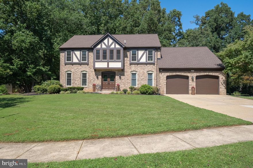 Special financing available! Eligible buyers may qualify for zero down, no PMI, and a $5,000 grant toward closing costs!! Call for details! 
Welcome to 4900 Lisborough Terrace, Bowie, MD a Timeless Tudor Colonial in Holmehurst West, one of Bowie’s most desirable neighborhoods! This 5-bedroom, 3.5-bath Tudor Revival colonial offers over 4,000 sq. ft. of living space on a premium flat corner lot.
Inside, you’ll find a spacious formal living and dining room, an updated kitchen with a center island, and a large family room featuring exposed beams and a brick fireplace wall. Upstairs, the primary suite includes a walk-in closet and an ensuite bath, with hardwood floors throughout all bedrooms. The finished basement expands your options with a wet bar, a bonus room, and a full bath. Step outside to a private backyard oasis with a concrete patio and mature trees.
Recent updates: new roof (2022), lighting (2021), windows (2021), an iron-detailed front door, new hardwood floors upstairs (2019), renovated bathrooms, fresh paint, and updated lighting throughout. Virtually every surface has been refreshed.
Located on a quiet cul-de-sac with cherry blossom trees, this former model home also has convenient school bus stops right out front. Move-in ready, full of character, and beautifully updated—this is a true Bowie gem!