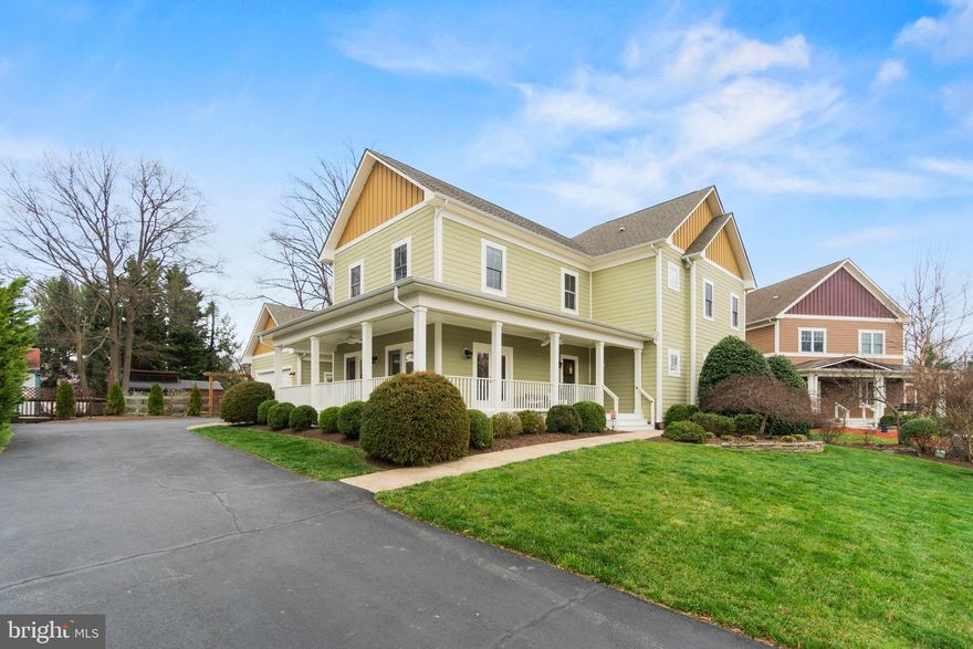 Welcome to Monroe Hill, an enclave of Craftsman-style homes tucked away on a tranquil cul-de-sac just steps to Historic Downtown Herndon. Built by Doll Homes (a premier local builder), this home features an impressively finished square footage of over 5000, three fully finished levels, 4 Bedrooms, 3.5 bathrooms, an amazing primary en-suite bedroom with an impressive walk-in closet, a spa-like bathroom, hardwood floors on the main level and stairs,  new carpet, a fully finished basement with a theatre room, wet-bar, and a walkup stairs access. This home is designed for today's lifestyle, with an open concept floor plan with an inviting family room, a gourmet kitchen with tall 42" custom cabinetry, a large gathering custom kitchen table, a spacious family room with a gas fireplace, and a spacious gathering room, and an inviting dining room.  This home is made for entertainment with a spacious front porch, an oasis private backyard, and a custom outdoor patio. You'll love living in the heart of the Historic Herndon and just a few steps away from restaurants, bars, Aslin Beer Co, the forthcoming Herndon Biergarten, the library (to name a few), and the W&OD Trail. With a Walk Score of 82, this location is truly a walker's and cyclist's dream!