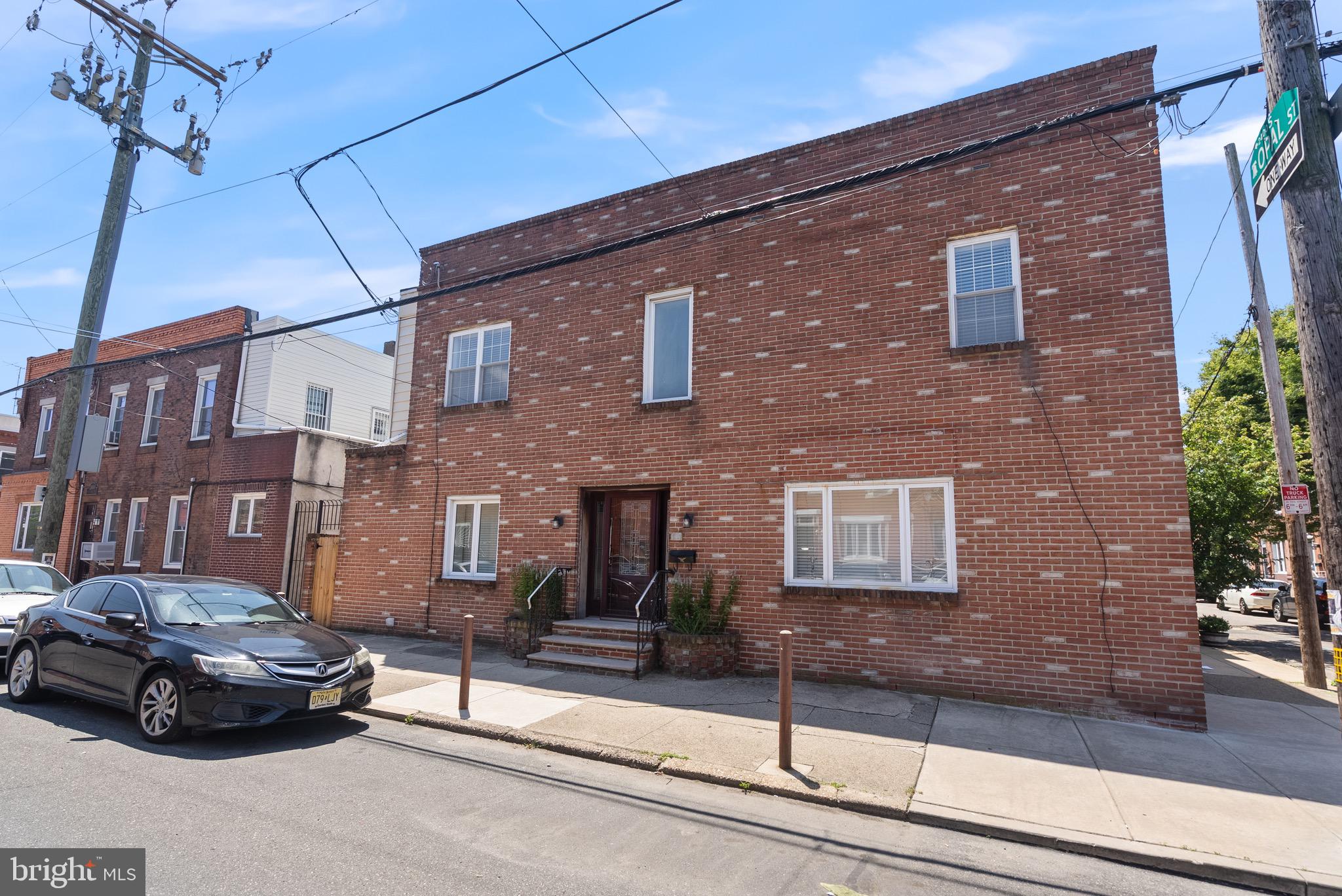 Beautiful Corner Townhome in the Historic Girard Estates neighborhood of South Philly! This Home has many new upgrades and is move-in ready! Basement - full and partially finished with brick fireplace, new laminate flooring, paneled walls, recessed lighting, dropped ceiling, and rear laundry room with washer and dryer, 40 gal. electric hot water tank, and storage space. 1st floor - Large living room with new laminate plank flooring, papered/painted walls, spiral staircase, large window, and non-working (Gas Line not hooked up) fireplace; lovely entry door and area; ceramic powder room; dining area with hardwood floors and chandelier; Modern kitchen with upper/lower wood cabinets, hardwood flooring, Formica counter tops, large sink with new faucet, stainless steel refrigerator, wall oven, GD, dishwasher(Not operational), electric cooktop stove with range hood, and door to rear fenced yard. 2nd floor - Three(3) nice-sized bedrooms with plenty of closet space and vaulted ceiling in main bedroom and new laminate flooring in main bedroom, 2nd and 3rd bedrooms are carpeted, new recessed lighting in 2nd floor hall, 2nd floor hall and bedrooms are freshly painted, bedrooms have plenty of natural light from windows, and full 3-piece ceramic tile bath with new vanity. Roof has been recently serviced! HVAC on 2nd floor is not operational but seller will credit for this to provide HVAC!