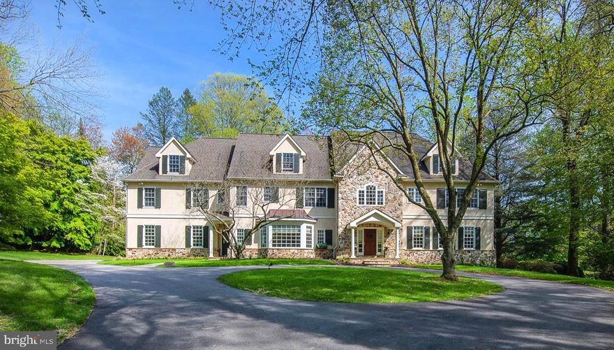 Conveniently located in one of the most beautiful neighborhoods in Bryn Mawr, this well-appointed custom estate home is nestled on just over 1.67 acres in a park-like setting. The extensive millwork, arched doorways, coffered ceilings, hardwood floors, and 5 fireplaces all contribute to the grandeur of this spectacular  home. The spacious layout is open and ideal for today's modern lifestyle. 
As you enter the foyer, you are greeted by sunlight from every room and an elegantly curved wooden staircase.  This home features solid maple and cherry hardwood floors with arched doorways flowing into the living and dining room areas.  The gourmet kitchen features granite countertops, a large island, a subzero refrigerator, a Wolf 6-burner gas stove, 2 Bosch dishwashers, double ovens and maple custom cabinetry. There is ample seating in the kitchen as well as in the step-down formal dining room, and the light-filled breakfast nook for all types of entertaining. The adjacent family room features 20-feet ceilings, a floor-to-ceiling paneled wood-burning fireplace, custom built-in shelving, and spectacular views of the rear yard through its wall of palladium windows.  The kitchen and family room both feature two slated patios that are perfect for relaxing evenings with a glass of wine.  A quiet first-floor paneled office/library with a gas fireplace can be found away from the hub of the kitchen.  The living room also has a natural gas fireplace and large windows overlooking the tranquil and beautifully landscaped rear yard.  Just off the kitchen is a spacious mudroom with built-in storage with an  additional staircase to the second level, and an entrance to the pristine three-car garage with new epoxy flooring, and a back staircase to the basement. The first floor is complete with 2 half baths and plenty of extra storage.  

The second floor contains an elegant master suite with a majestic sitting room with its own gas fireplace and a large master bath suite with a soaking tub and travertine tile stall shower and bench, spacious closets, and a large private dressing area.  Four additional ensuite bedrooms, all with walk-in closets, and a large laundry room with cabinetry complete the second floor. Another full staircase transcends to the semi-finished third floor, which has been used as a multi-purpose gym and playroom; it could easily be transformed into additional bedrooms, offices, or additional living space.  

Off the main foyer a curved wooden staircase leads to the finished bright and comfortable lower level with a 6th full bath, wood-burning brick fireplace, tons of storage/flex space, and a walk-out to a lower-level slate patio. 

Step outdoors and enjoy the beautiful grounds, complete with a treehouse, tree swing, basketball hoop, and a zip line. Other features include an indoor-outdoor surround sound speaker system by Audio Source, a Honeywell security system, radiant heated floors in all upstairs bathrooms, a 70-gallon high efficiency tankless hot water system, and too many other upgrades to mention! Located just minutes away from the Septa train, some of the best public and private schools, beautiful parks, restaurants, and shops, this home is zoned for Gladwyne Elementary and within walking distance to Harriton High School. 
 Call for an appointment today!