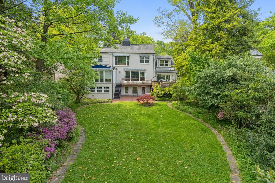 Woodside Park Classic with enchanting, private, expansive back property.  A large home with walk-out lower level offering endless possibilities.  Move in ready.  A truly special home.