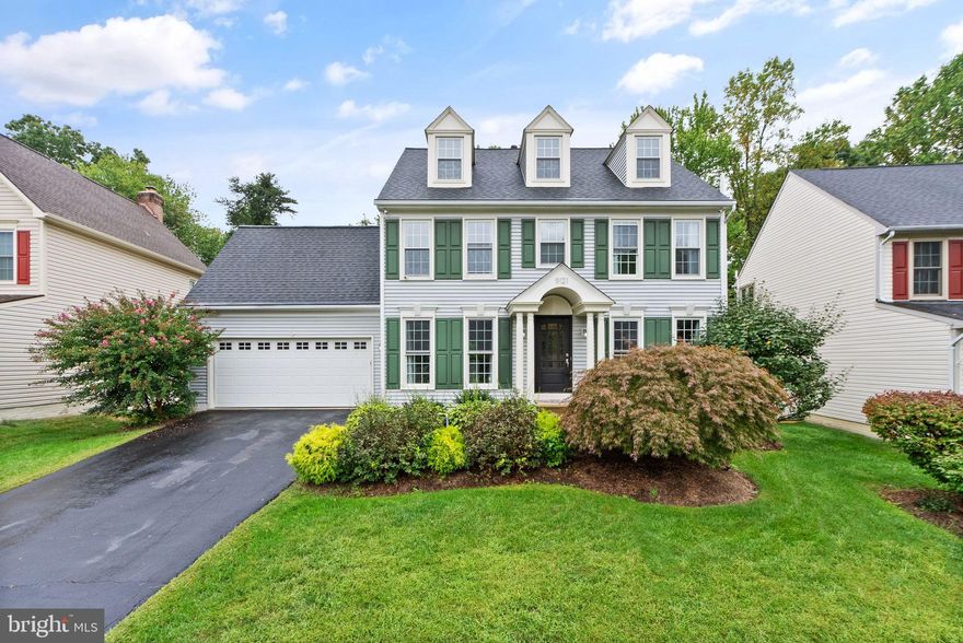 Nestled on a quiet street in the highly desired Crosspointe community, this colonial is a stunner! The pride of homeownership and spectacular design taste is evident from the moment you step in the front door. The lower level features gleaming wood floors, spacious dining room, two living areas, all which flow seamlessly into the highlight of the home - the gourmet kitchen! The bright white cabinetry with ample storage space is complemented by the breathtaking counters, waterfall island with custom stonework, stainless farmhouse sink, and the culinary oven/range. Tons of natural light flows in through the gorgeous windows, highlighting the wainscoting, built-in media center cabinets and shelving, and the custom glass tile accent wall surrounding the fireplace. The crisp powder room on the main level is perfect for guests. On the upper level, you'll find four spacious bedrooms and two full bathrooms. The primary suite provides the optimal space for rest and relaxation, with vaulted ceilings, an enormous walk-in closet, and an exquisite primary bathroom. One of the upper level bedrooms also features a bonus room with vaulted ceilings and additional closet that could be used as a craft room, office, workout room, nursery, or anything your heart desires! The options are endless. The partially finished basement features even more custom stone accents and a full bar with built-in taps. The unfinished section of the basement is perfect for seasonal storage and also includes an extra fridge to store food for your culinary experiments in the gourmet kitchen! The upgrades continue in the two car garage with a plethora of cabinets for all your tool storage needs. The backyard is your own private oasis - low maintenance hardscape and pea gravel complement the expansive deck and pergola for year-round enjoyment. The modern updates throughout provide the perfect blend of style, comfort and convenience.