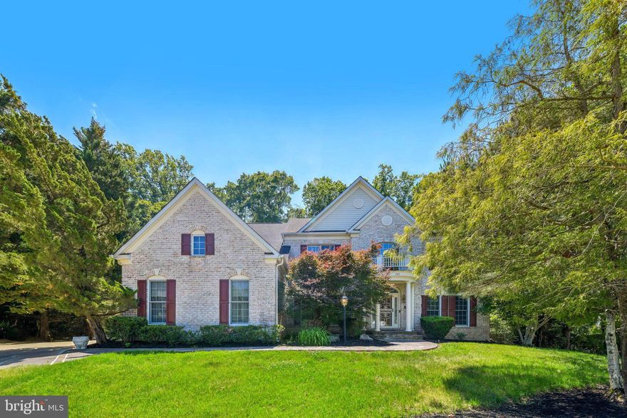 Welcome to 101 Whistling Wood Court. Poised in the gated Farmington Woods enclave, this 6,000+ sq ft custom estate has been freshly updated and meticulously maintained for its next owner. Experience architectural elegance from the moment you enter the two-story foyer, leading to a great room framed by soaring Palladian windows and tranquil forest views.

The gourmet kitchen flows seamlessly to a sprawling deck—perfect for indoor-outdoor hosting. Retreat to a massive primary sanctuary featuring a double-sided fireplace and spa-inspired bath. The fully finished walk-out lower level is a true entertainer’s hub, complete with a custom bar, and library. With recent paint and professional repairs just completed, this home offers timeless craftsmanship and rare value in a prime location minutes from DC and VA.