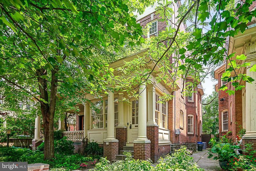 4618 Hazel Ave offers a rare chance to own a historic, thoroughly restored Victorian-style home unique to West Philly's highly sought-after Cedar Park neighborhood. Tucked away on a picturesque, tree-lined block in the prestigious Penn Alexander school catchment, this grand 3-story residence boasts 5 bedrooms, 4.5 bathrooms, a large back patio, and a host of smart-home features. At the front of the home, you're greeted by pristinely kept greenery and an intricate facade with original pillars and brick columns. A sun-drenched enclosed porch welcomes you inside. Through the vestibule, you'll discover a large, bright living room anchored by a decorative brick fireplace and wainscoting. The home's historic character is proudly displayed in the refinished hardwood floors and bespoke millwork that traces the intricate bay windows, frames the ceiling, and surrounds the staircase. The hardwood floors continue into the expansive dining room, ideal for entertaining with tall bay windows and a coffered ceiling that's certain to catch the eye of every dinner guest. The heart of this spectacular home is undoubtedly the massive eat-in kitchen that completes the main level. Adorned with high-end stainless steel appliances, Carrera marble countertops, an oversized stainless sink, a separate sink for food prep, and a four-person island, this kitchen is the perfect gathering place for the whole family! Off the rear of the home, there's a large, secluded patio with tons of space for relaxing on cool spring days or dining al-fresco on warm summer nights. At the front of the home's second level, there's a large guest bedroom with hardwood floors, high ceilings, crown molding, huge bay windows, and a decorative fireplace with a wood mantle and mirror. The rear of the second level has been reconfigured for the new primary suite. There's a large bedroom, a separate office, a custom walk-in closet with a highly functional design, and a thoughtfully placed laundry room with a top-of-the-line LG washer and dryer. Completing the primary suite is a luxurious spa-like ensuite with ornate tile floors, intricate glass windows, two pedestal sinks, a soaking tub, a glass-enclosed dual-head shower, and Carrera marble throughout. On the third level of the home, there are three spacious bedrooms, each with its own private ensuite bathroom. In the last year, the home has received a new aluminum fiber coating on the main roof, completely new roofing on all eaves with copper flashing, new internet lines for an improved Wi-Fi experience, and a fresh coat of paint throughout the interior. Some of the home's modern updates include 20+ new high-efficiency windows, a solar panel roof, 100% LED lighting, an electric car charging station, 2-zone Honeywell app-controlled thermostats, Kasa smart home controls, Google Nest smoke & carbon monoxide detectors, security cameras, a Ring doorbell camera, and baby proofing throughout with optional custom baby rails. In addition to all that's offered inside 4618 Hazel Ave, its lively Cedar Park neighborhood in the West Philly section of the city is a walker's paradise with a Walk Score of 95! Nearby Baltimore Ave is lined with friendly, diverse shops and restaurants, including Mood Cafe, Ice Cave, Loco Pez, Hayashi Sushi, and Lee's Deli. Just a few blocks south is Clark Park, a sprawling 9.1-acre park that hosts community events and a weekly farmer's market. This central location is also close to the University of Penn Hospital, University City, and 30th Street Station, with plenty of public transportation and easy access to Walnut St, Chestnut St, Grays Ferry Ave, and I-76. This home also falls in the Leah School Catchment, which recently announced a major partnership with U Penn to model the school after Penn Alexander. This is a rare opportunity to own a spectacular, updated, historic home in a wonderful neighborhood! Schedule your in-person or virtual tour today!!