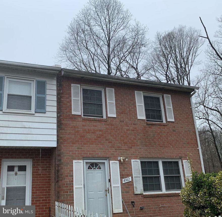 This spacious end unit home, with back to trees, is located in the Dale City Subdivision.   It has a separate dining room and eat in kitchen, which was updated in 2019.  The kitchen has stainless steel appliances that are 2 years old.  The home has 3 bedrooms, with a possible 4th in the basement.  There is a full bath in the basement.  The walkout basement contains a wood burning fireplace that is great for cool winter evenings or roasting marshmallows.   The large backyard  has a covered patio, great for grilling in the rain.  In 2020 the roof and the tile floor of the half bath on the main level were was replaced.  HVAC is less than 5 years old.  This home will not last long.  SHome is being sold As Is.  Seller wants a very quick settlement.