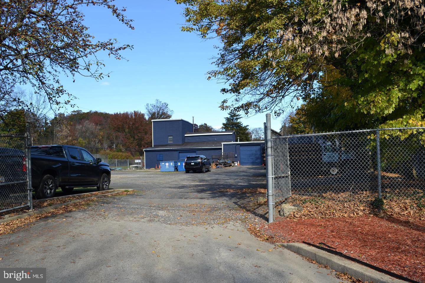 Commercial garage space in convenient location. This building has one roll up door, an office area, 2 bathrooms and a large open space with new lighting, gas heat and mini split air conditioning. The parking lot is shared between three business with 4 parking spaces. This is a great space for a small business, warehouse or car enthusiast.