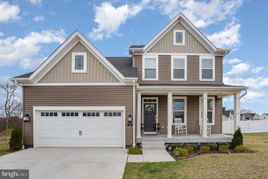 Welcome to this beautifully maintained two-story home, built in 2022 and located in the desirable Hickory Ridge Mews subdivision. This home offers the perfect blend of style, space, and functionality. Step inside to a bright bonus room—ideal as a home office, playroom, or second living area. From there, move seamlessly into the heart of the home, where an open-concept layout connects the kitchen, dining, and family rooms—perfect for both everyday living and entertaining.

The kitchen is designed with practicality in mind, featuring granite countertops, stainless steel appliances, and a large center island that adds both prep space and seating.

Upstairs, you'll find four generously sized bedrooms, including a spacious primary suite with a walk-in closet and private bath. An additional full bathroom and a convenient half bath on the main level ensure comfort for everyone.

Enjoy the outdoors in the expansive, fenced-in backyard complete with a low-maintenance composite deck—great for summer BBQs and quiet evenings alike. Additional features include a two-car garage, driveway parking, and an unfinished basement ready for your personal touch.

This 2022-built home in Hickory Ridge Mews combines modern comfort and convenience with room to grow—don’t miss your chance to make it yours!