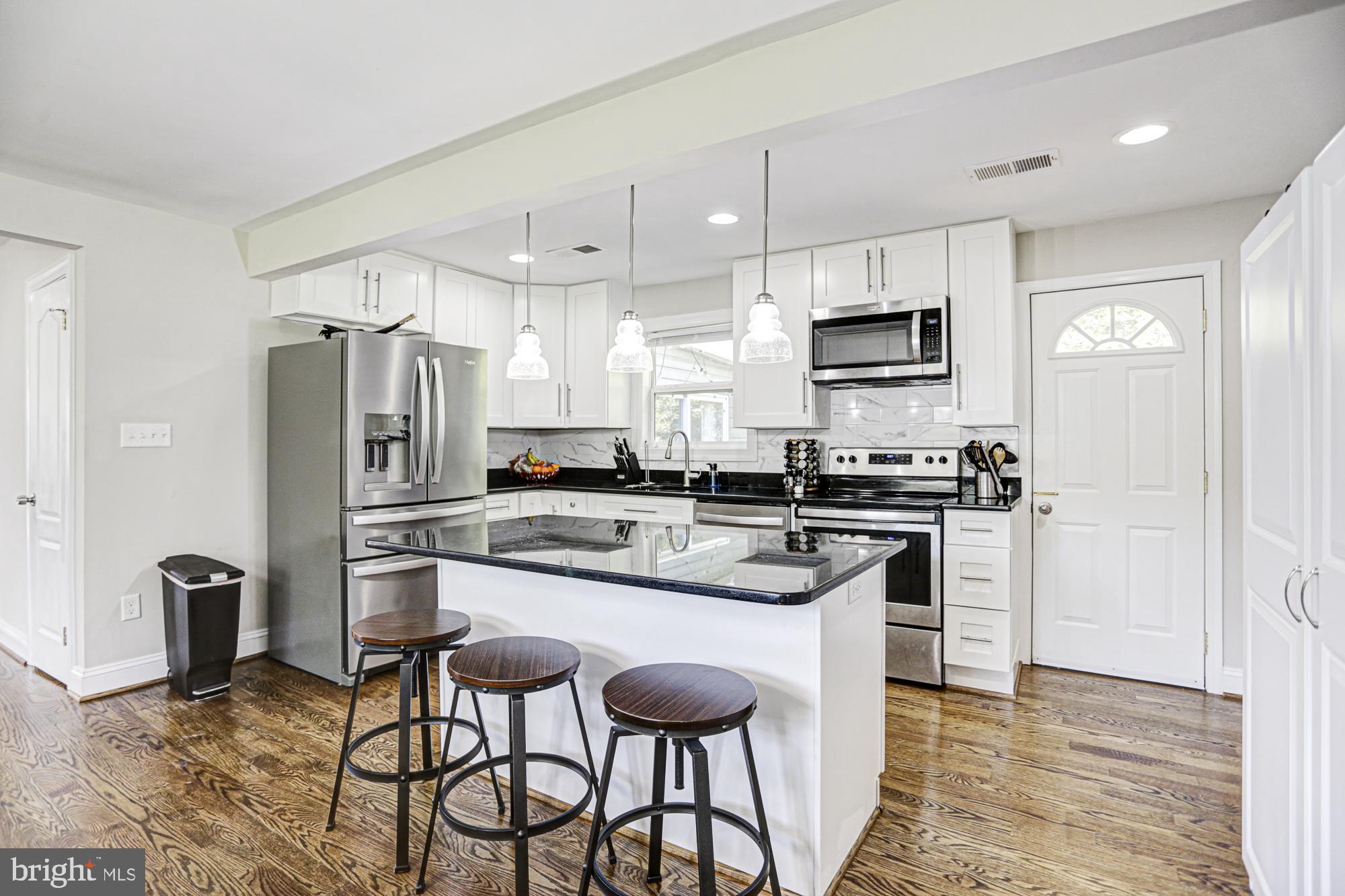 Don't miss out on this beautiful single family home sitting on 1.4+ acres! Renovated in 2019 to include a new roof, siding, insulation, duct work, plumbing, energy saving windows, electrical, and A/C system. With a beautiful open floor plan, modern kitchen, and recessed lighting throughout this could be the perfect home for you. Kitchen has granite counter tops, energy saving stainless steel appliances, and modern fixtures as well as hard wood floors. Primary-Suite has a full bathroom and private exit to back yard. With a total of 4 bedrooms, 2.5 bathrooms, and an additional room that can be used as a den/home office there's plenty of space. With a large driveway and 2 car garage you'll never have to worry about parking. Just a short drive to Joint Base Andrews, 495, Metro, MGM National Harbor, Old-Town Alexandria etc. Plenty of shopping and grocery stores nearby. This could be yours, don't miss out!