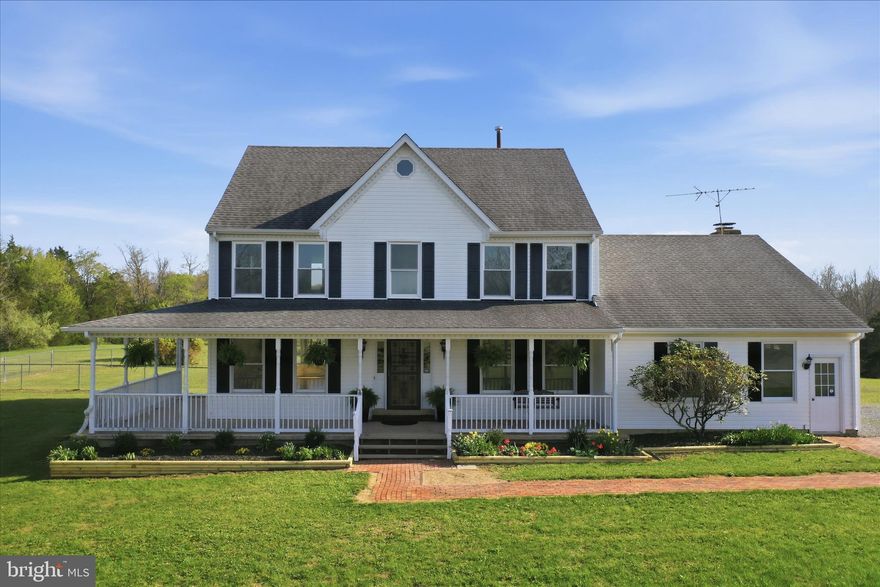 Tucked away on a quiet drive in Winchester, VA, this stunning Colonial-style home blends timeless charm with modern comfort on over 18 acres of serene, private land. Perfect for anyone seeking peace, space, and a true connection to nature, this property offers an exceptional lifestyle both inside and out. Step inside to a warm, inviting interior featuring rich hardwood floors on the main level and brand-new carpeting throughout the upper level. The open foyer is flanked by a private office and a formal living room, creating an elegant first impression. The heart of the home is the spacious, country-style kitchen, complete with: center island for culinary creativity and generous table space for casual dining. Step down into the  grand great room and sunroom.  The expansive great room features a raised-hearth brick fireplace perfect for cozy evenings and the sunroom shows off  the picturesque views. A formal dining room connects effortlessly to the formal living room, offering an ideal layout for gatherings and celebrations. On the upper level, the luxurious primary suite offers a walk-in closet and a spa-like bath with a jetted tub and walk-in shower. Additional bedrooms are generously sized, providing comfort and room for all. The unfinished walk-up basement offers endless potential, already equipped with a brick fireplace for a future recreation or relaxation space. For horse lovers, this property is a rare find. It includes:  2 fenced pastures, 2 run-in sheds, 2 troughs and ample acreage for riding, grazing, or expansion. The level, private lot is ideal for gardening, outdoor entertaining, or simply enjoying the sweeping views of the surrounding pastureland. A charming wrap-around porch invites you to savor morning coffee or unwind at sunset. This home is more than a residence—it’s a retreat. Enjoy the tranquility of country living while remaining just a short drive from local amenities. With space, privacy, and endless possibilities, this remarkable property offers a lifestyle that feels like a getaway every day. Don't delay to schedule your private showing of this remarkable property. Please NOTE: the entrance way from Airport Rd. is a blind entrance, it is safer to enter via Sorrel Ln. Follow the directionals....see you there.