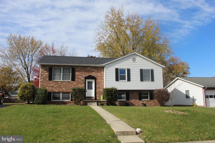 Discover comfort and convenience at this home. This charming 4-bedroom, 3-bath home features brand-new carpet in the bedrooms, beautiful wood floors throughout the main living areas, and a spacious deck overlooking a fully fenced backyard—perfect for relaxing or entertaining. Ideally located near a local shopping center, this move-in-ready home offers the perfect blend of updates, space, and a great location. Come see all it has to offer!