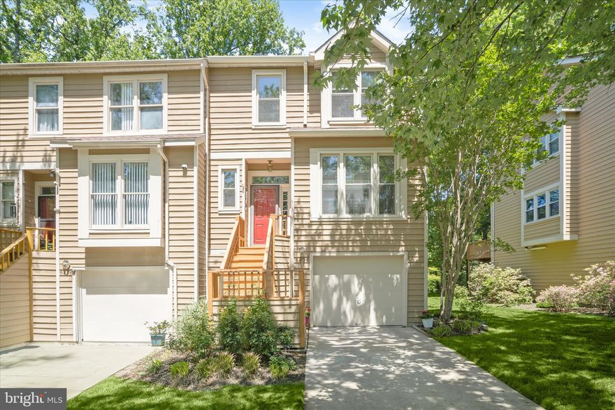 Nestled in the sought-after Cedar Woods community, this beautifully maintained contemporary end-of-row townhouse offers the perfect blend of comfort, style, and functionality. Boasting 2,240 square feet of thoughtfully designed living space, this inviting home is ideal for both everyday living and entertaining. The warm and welcoming living room features gleaming hardwood floors, custom window shutters, a cozy fireplace, and direct access to the deck. Adjacent to the living area, the dining room flows seamlessly into the well-appointed kitchen, offering modern appliances, LVP flooring, Granite Countertops, ample cabinetry, and a casual dining area perfect for morning coffee or family meals. A convenient half bath completes the main level. Upstairs, the impressive primary suite features soaring ceilings, a private balcony, and a beautifully updated, luxurious spa-inspired bath with a stand-alone soaking tub, double vanity, and walk-in shower. Two additional generously sized bedrooms and a full hall bath complete the upper-level sleeping quarters. The fully finished lower level provides additional living space with a spacious family room, garage access, extra storage, and walkout access to the backyard. Enjoy outdoor living with a deck, patio, beautifully maintained landscaping, and a peaceful tree-lined backdrop offering added privacy. Recent updates include the luxurious primary bathroom renovation, new roof, carpeting, sliding glass door to the deck, gutters, windows, and more. This exceptional home is more than just a place to live; it’s a place to create lasting memories. Experience the warmth, charm, and convenience of Cedar Woods living today!