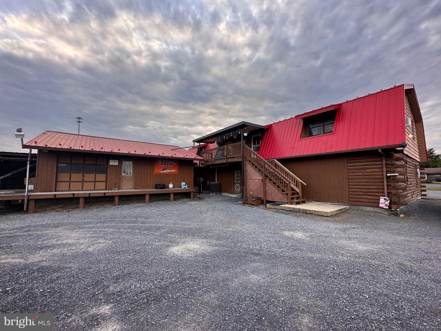 MULTI UNIT COMMERCIAL STRUCTURE FEATURING LARGE (46 X 30) 1ST FLOOR FRONT BUILDING W LOG/VINYL SHAKES, METAL ROOF, PORCH, PAVED PARKING IN FRONT, BATHROOM, KITCHEN, FRONT & REAR DOORS, CONCRETE FLOORS & UTILITY ROOM.  (2) OVERHEAD 2 BEDROOM APARTMENTS, REAR SHOP (24 X 30) & (4) OPEN BAY GARAGES W METAL ROOF, GARDEN/PLANT AREA (12 X 24) AND ALL SITUATED ON .591/ACRE OF LAND. OTHER AMENITIES: 200 AMP SERVICE, ELECTRIC H-WATER TANK, HEAT PUMP, CENTRAL AIR, 3 SEPARATE METERS, LOG/T-111 SIDING, ALL NEW PECKS PLUMBING THRU OUT, NEW 4 TON HVAC UNIT INSTALLED. FRONTING ON PRESIDENT STREET.  GREAT BUSINESS OPPORTUNITY! HIGH RENTAL INCOME!  HIGH-END FIRE ALARM  SYSTEM AND KITCHEN APPLIANCES CONVEY.