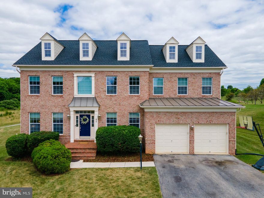 Beautiful approximately 5,000 sq ft brick front home in Deerfield Village, situated just outside of Shepherdstown. Five bedroom 4.5 baths make this one of the largest homes in Deerfield, a planned cluster community with green space and walking trails . Floor plan features an open concept from kitchen to family room to large trek deck, perfect for entertaining a large gathering.   Work from home in the  main floor office that is filled with natural light. Large finished lower level with full windows has a  bedroom with full bath and tons of room for a home gym, kid hangout... you name it! Upper level primary oversized suite gives the new owner a sitting area, walk in closets and a large bath. 
Pet free home  has been well maintained by current owners, roof was replaced in 2022.  This amazing home is truly a must see.