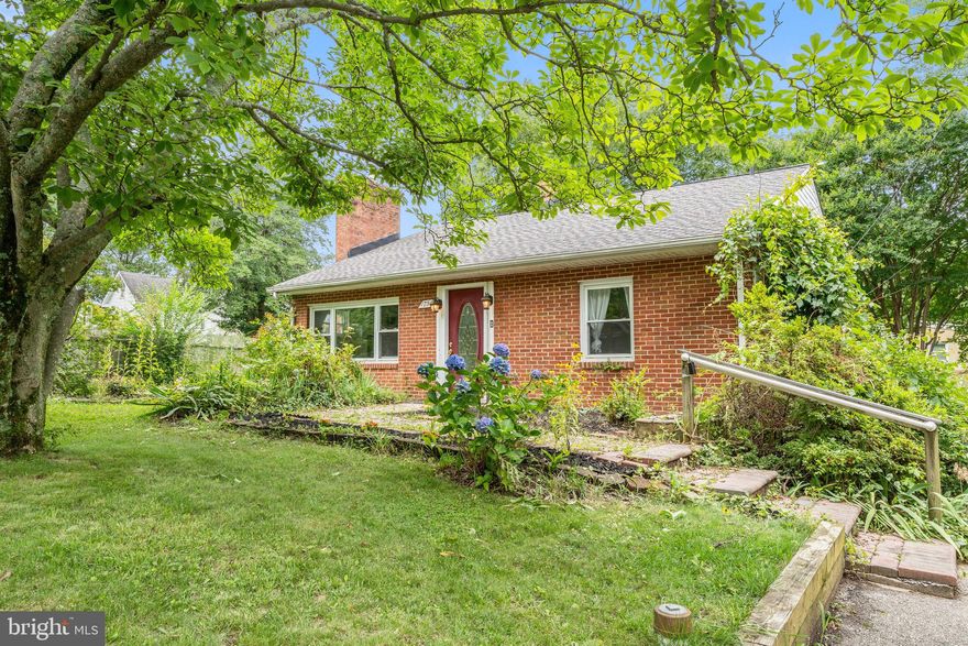 In the highly desired Woodland beach community, this adorable cottage is move in ready but still has room for endless possibilities to make it your own! 

Beaming with natural light from the bay window the living room is open with a gas fireplace, and built in shelving. Kitchen features SS appliances, and granite counters. Separate utility room with storage space, and stackable washer & dryer.  The rear sunroom is a huge selling point, with vaulted ceilings and plenty of room to entertain family and friends. Two slider doors lead from the sunroom to the back deck where you can enjoy morning coffee or a weekend BBQ. Fenced in yard, and plenty of privacy. 

Complete with vinyl flooring throughout the house. Including 2 generous sized bedrooms, sharing an updated full bathroom right off the hallway. 

Water privledged community, with tons of amenities. Just a few blocks from the water with access to the community pier, 5 sandy beaches, playgrounds, picnic areas, a marina and boat ramp! 

Please note that the tax record for square footage is not correct. The home is approx. 1300-1400sqft. 

Schedule your showing today!