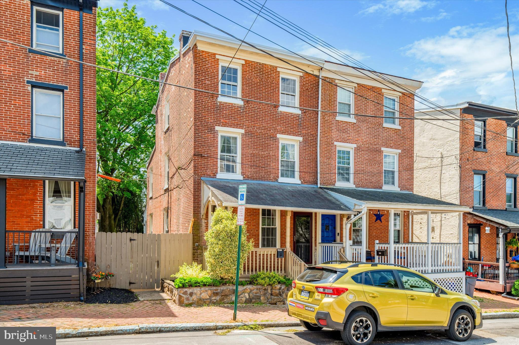 For anyone desiring a quaint community with both historic and contemporary flair, here is your chance to reside in a very well maintained and charming 4 bedroom, 2 bath brick home perfectly located within walking distance to all that West Chester Borough has to offer (with great parking options too...*see below). The curb appeal with covered front porch and brick herringbone patterned sidewalks adds to the ambiance. Step inside the bright living room with tall ceiling  featuring vinyl plank flooring and crown molding that continue into the dining room. The dining room has a pass through window into the kitchen giving both rooms a nice open feel. The kitchen features beautiful oak cabinets, tile backsplash, and stainless steel appliances including a built-in space saver microwave and extra counter space with bar seating.  Off the kitchen, you will find a convenient mud room with dishwasher, and washer & dryer, which also provides access to a full bath. Upstairs there is a spacious primary bedroom with double closet and crown moldings along with a 5th bedroom that has been converted into a wonderful walk-in closet with built in organizers. The updated hall bath has tile floors and an oversized quartz topped vanity. The three additional bedrooms all have ample space with lots of natural light.  Additionally, there is a full basement great for storage and an outdoor patio great for barbecues with friends. The HVAC is a high-efficiency gas hot air system and central air has been added as another bonus. *There is ample on-street parking,  with convenient access to a parking lot (located caddy corner from home), and a nearby covered parking garage all available with a parking permit easily obtained from the Borough. A rental parking permit is only $15 per year.  The house is in Zone F.  This allows for free parking at the meters in the parking lot caddy corner to the property as well as any of the metered parking on streets in Zone F. (See attached zoning map). You will love the global selection of restaurants, shopping boutiques, cafes, bistros, and the enjoyable night life with different venues for all ages. The landlord prefers a 2-year lease. Now is your opportunity to reside in this warm and welcoming home.