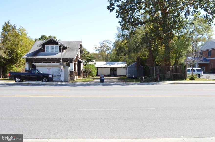 This property is .45 of an acre, there are 3 buildings on the property: a house that needs renovating, a military barrack, and a cold storage building. There is also a car port large enough for two box trucks. The location has quick access to Route 100, and to MD. Route 3.  The property has almost a hundred feet of frontage on Crain Hwy. Great for flex space , make the house into office space.