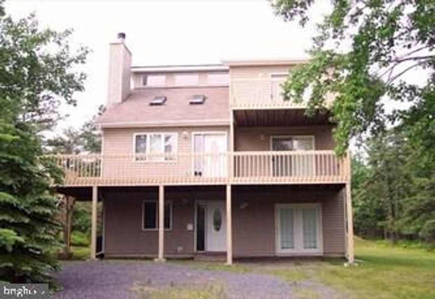 Spacious three story home in popular Pocono community.  This home features three stories of living space with at least one bedroom and one full bath on each level.  The first level offers a large bedroom with separate entrance and a large game room with full bath and sliders out to a lower level deck with hot tub.   The second floor is the main living area and features an open kitchen with dining area, living room with vaulted ceilings and gas fireplace as well as the master bedroom suite with its own bathroom and jacuzzi tub.  There is also a second level deck across the entire front of the home as well as sliders to a rear screened porch  that opens to the rear deck overlooking peaceful back yard that enjoys bright sunshine all afternoon. The third level offers two additional bedrooms, one with vaulted ceiling and third level deck, the third full bathroom and an open loft area that offers many possibilities.   The home is currently used as a short term rental but would make a great primary residence or second home getaway.     Schedule your tour to see it today!   Owner is a licensed Realtor.