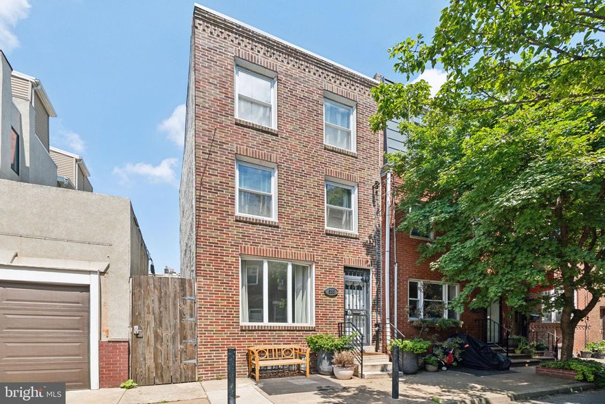 Welcome to this beautifully updated 3-bedroom, 2.5-bathroom row home nestled in the heart of Bella Vista! Fully renovated in 2019, this inviting home with open floor plan is finished with all new HVAC, plumbing, electrical, and a brand new roof (2024). Enter through the charming vestibule to the bright living room, leading to the Chef’s kitchen and powder room for convenience. The kitchen boasts modern stainless-steel appliances, a 5-burner gas stove with a pot filler, stunning waterfall quartz countertops, a wine cooler, and ample cabinetry. Off the kitchen is the back patio, making this first floor perfect for entertaining and outdoor hangs.
On the second floor, discover the luxurious primary suite with walk-in closet, alongside a full bathroom with spacious stand-up glass shower and dual-vanity sinks. Venture to the third floor to find two additional bedrooms and full bathroom complete with a glass enclosed shower. In the basement you’ll find the laundry area and plenty of storage space, perfect for customization to suit your needs. Steps to Queen Village and the Italian Market, this home is located only blocks from a variety of parks, plus an array of restaurants, cafes, eateries and shopping. Check out this home which presents an unbeatable urban lifestyle in the vibrant Bella Vista community!