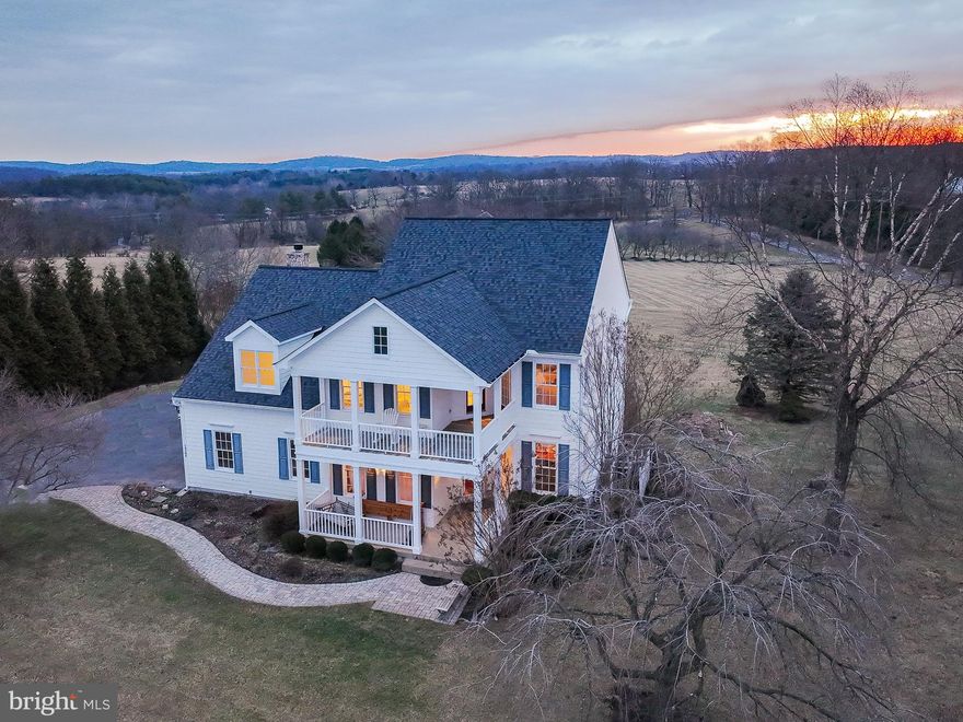 Southern charm awaits!  This exquisite residence boasts a charming two-story porch with a veranda, enhancing the living space in this remarkable home. Perfect for both entertaining and unwinding, it offers breathtaking views of the Catoctin and Short Hill Mountains, where you can savor the beauty of sunrises and sunsets.  Nestled amidst the picturesque vineyards, breweries, and farms of Loudoun County, this property spans 1.01 acres (but the conservancy area behind and the common space to the side make it feel as though you own 6 or 7 acres).  Custom-built by Burke Homes this residence provides 4 bedrooms and 2.5 bathrooms on the 2 levels above grade. The unfinished lower level, with 1460 square feet of space, is equipped with walk-up stairs and rough-in plumbing, allows for an additional bathroom to be added as the new owner desires.   This fine house also has a spacious rear deck (16' x 22') with a dual staircase to the yard for relaxing or entertaining. The 2 car sideload garage is oversized at 23' x 22'.  New neutral colored wall to wall plush carpet installed January 2025 and fresh painting was just completed in February 2025.  Elegant wide plank cherry hardwood floors in Foyer, Dining Room, Living Room, Kitchen, Study, Powder Room, and Main Hallway are complemented by crown molding and oversized trim boards.  Kitchen also has a new suite of stainless-steel appliances.  Located near C&O Canal tow path, the W&OD Trail, Potomac River as well as the Lovettsville Community Center (with horse riding trails, athletic fields, and swimming pool), Waterford’s Greystone community pool is also close at hand, and Franklin Park Arts Center along with Franklin Park Waterpark and Ball Fields.  Within easy reach of the vibrant shopping centers of Purcellville and Leesburg, this home offers a blend of luxury and convenience.   Waterford and the surrounding communities host a variety of wonderful events each year - The Waterford Craft and Arts Fair in the fall and the Loudoun's County Fair in summer and the Loudoun Farm Tours are just a couple favorites.   ** New shower door to be installed before 3/10/2025 - see photos **

Noteworthy Seller Updates and Upgrades -
Hardwood Floors in 2017 -
HVAC (upper system) in 2017 -
HVAC (lower system) in 2021 -
Driveway in 2020 -
Roof in 2021 -
Tankless Water Heater in 2024 -
Wall to Wall Carpet in 2025 -
Interior Painting in 2025 -
Smoke detectors in 2025 -
New Primary Bath Shower Door - to be in by 3/10/25