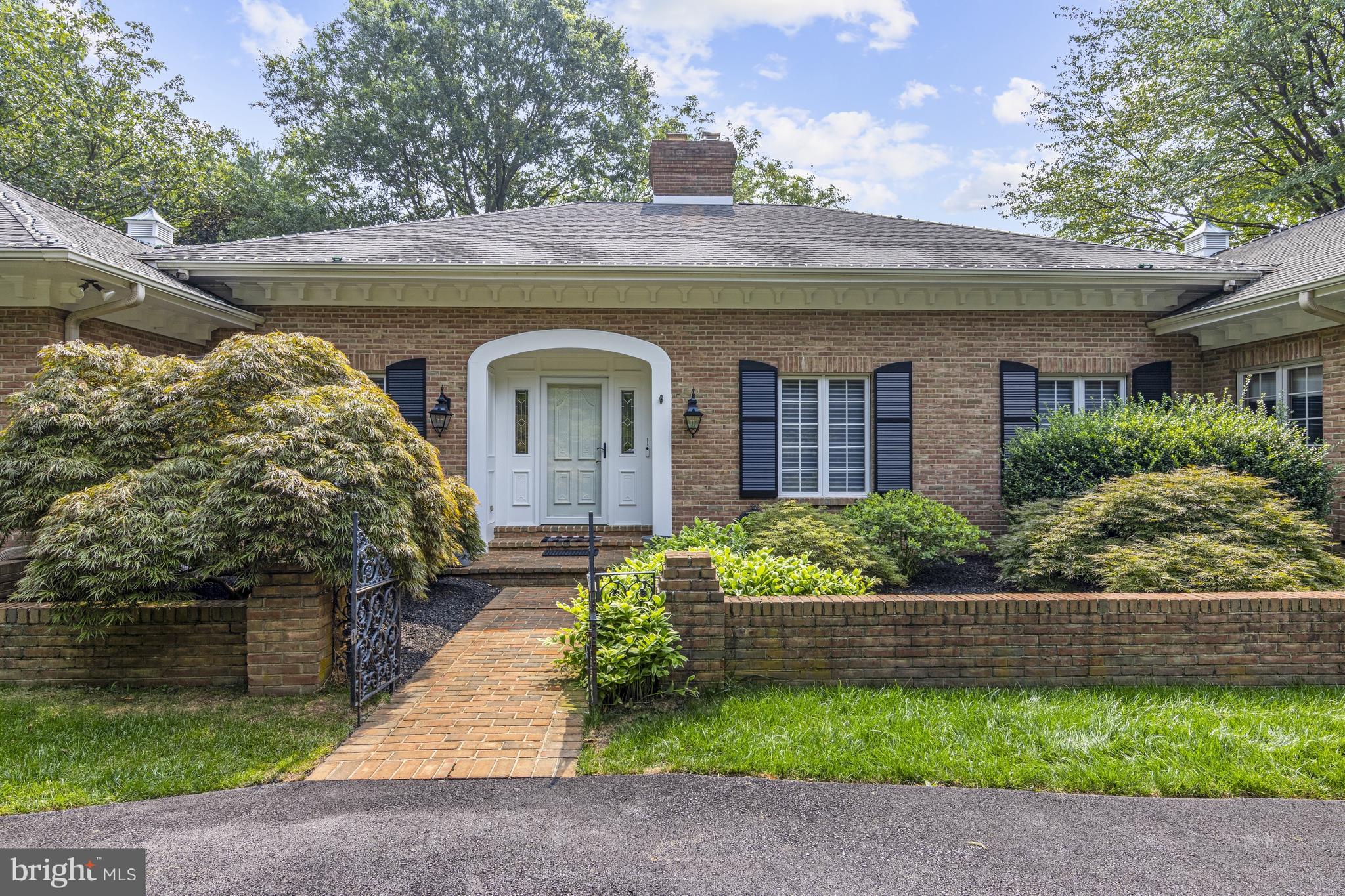 Architecturally welcoming with a sweeping driveway approach, this beautiful custom built ALL BRICK ranch home on 4.7 private acres in Pennsbury Township, Chadds Ford. This home is located in the Unionville-Chadds Ford School District. The over sized two car garage enters the home into a generous back hallway adjacent to an extremely large laundry and mudroom. This flows directly to a private screened in porch with added heat and AC to allow for enjoyment year round. Formal spaces like the large dining room and home office blend seamlessly into less formal spaces like the kitchen with adjacent family room. Many windows across the back of the home provide views of the gorgeous back yard which is private and stunningly beautiful and serene. Main floor has 3 bedrooms(Primary and 2 generous guest rooms) and 2 full, 2 half baths and a mudroom/laundry with full shower - one floor living. Lower level offers separate living space with a full kitchen and gorgeous upgraded bathroom. This will provide for endless possibilities to accommodate in-law suite, bedrooms for overflow guests, craft room or movie room, gym or second office as needed - there are endless possibilities with these areas depending on your needs.
Major updates in 2021 include the majority of main floor living space which was taken down to studs and completely redone to make floor plan more efficient. All new mill work, gleaming freshly refinished hardwood floors and newly added Home Office and Powder Room. The chef's kitchen was remodeled in 2021 to include double wall ovens, 6-burner gas range, quartz and custom cabinetry. Primary bath remodel was remodeled 2021 and includes closet was redone in 2024 by Closets by Design to include new custom shelving system. New HVAC units (2) 2022, Generac whole house generator installed 2021, new water treatment system, resurfaced driveway 2024, extensive landscaping include the addition of natural areas, mulching and tree removal.
Located just minutes from the Delaware border in Greenville, and easy commute to Wilmington, PHL and Center City Philadelphia.