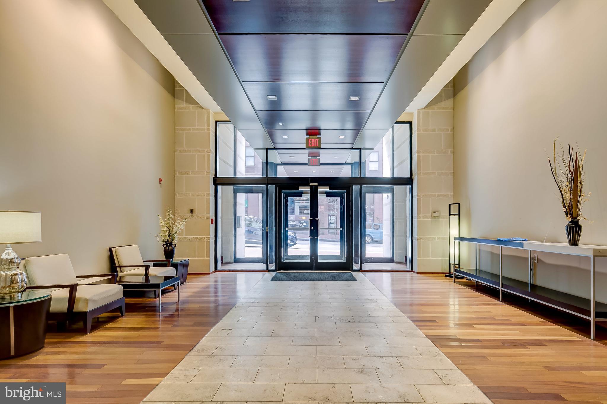 Now is your opportunity to rent this luxurious, grand condominium in coveted 1209 N Charles.  Located in the heart of Midtown/Mount Vernon, mere steps to art houses, theaters, the Baltimore Symphony Orchestra, Univ of Baltimore and restaurants offering an array of international cuisine.  2 blocks to Penn Station for MARC/Amtrak travel to DC, Boston and points in between.  Perfect for relaxing and entertaining, this super-sized 1br of almost 1,200 sq ft offers plenty of space and features including tall 10' ceilings, large bay & floor to ceiling windows allowing lots of light.  Gleaming wood flooring, stainless steel kitchen appliances with gas cooking, breakfast bar, dual vanity bath suite and much more.  Large storage locker (steps from the condo) and dedicated garage parking space included!  Bldg offers residents a private, landscaped interior courtyard, an on site gym, and more.  Starbucks, restaurants, retail on ground floor!  Rent includes storage unit and parking.