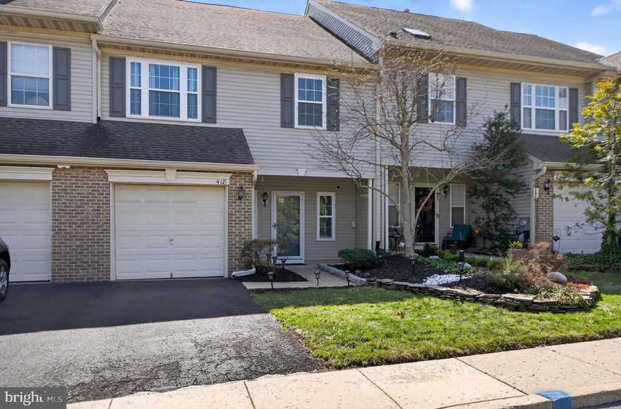 Welcome to Fieldstone, one of the most beautifully landscaped townhome communities in Bucks County. Living here feels like a retreat from the everyday, yet you are just moments from the charm, dining, and culture of downtown New Hope.
This beautifully updated two-bedroom home offers a bright, open floor plan designed for comfortable everyday living. The dramatic two-story Great Room features a wall of brand-new south-facing windows that fill the space with natural light and an electric fireplace that creates a warm focal point. The living area flows seamlessly into the kitchen, making it ideal for both quiet evenings at home and entertaining.
The kitchen features brand-new countertops, stainless steel appliances, generous cabinetry, and new sliding doors leading to the private rear deck. The main level also includes a first-floor flex space, powder room, storage closet, and access to the attached garage.
Upstairs, the primary suite offers vaulted ceilings, generous closet space, and an en-suite bath with soaking tub and separate shower. A second bedroom, full hall bath, and convenient laundry/utility room complete the second floor.
Enjoy morning coffee on the covered front porch or relax on the sunlit rear deck with southern exposure. Located in the highly regarded New Hope–Solebury School District and just minutes from New Hope’s restaurants, galleries, and boutiques, this home offers the perfect blend of tranquility and convenience.