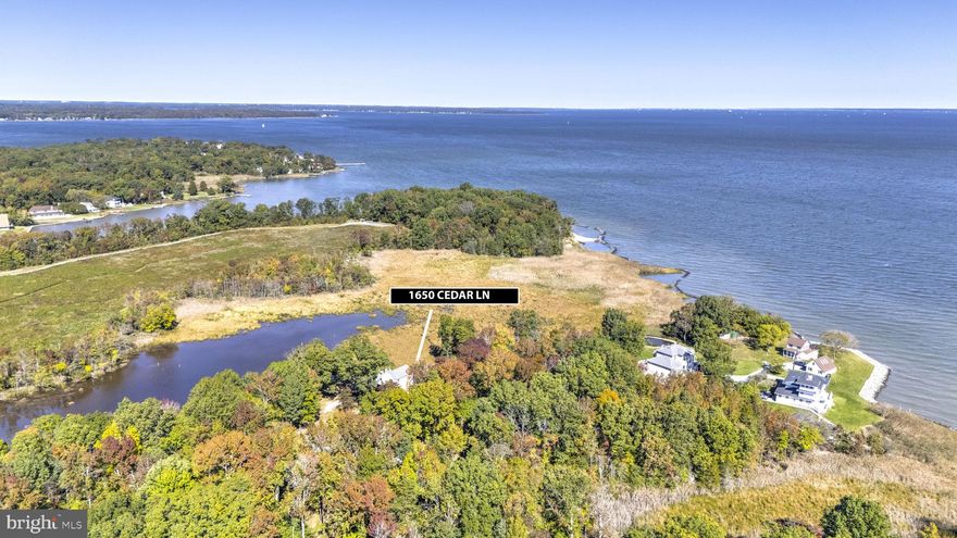 Experience Unmatched Privacy and Tranquility from this unique non-riparian waterfront home set on over 3+ scenic acres. Fall in love with sweeping water views and the serene presence of native wildlife—waterfowl, deer, eagles, and more—all just outside your door. Enjoy panoramic vistas of a natural pond, with the stunning Chesapeake Bay visible in the distance. On clear days, the Bay Bridge is even within sight. The home features a relaxing screened porch, a spacious kitchen that flows into a cozy living area with a wood stove—perfect for chilly evenings. The main level includes a bedroom and full bath, plus an additional room ideal for an office or second living space, also with a wood stove. Upstairs, the primary bedroom offers breathtaking water views, accompanied by another bedroom and a full bath. A barn/stable on the property makes it ideal for horses or a home-based business with office space. This is truly a one-of-a-kind property—peaceful, picturesque, and full of potential. Come see it for yourself.