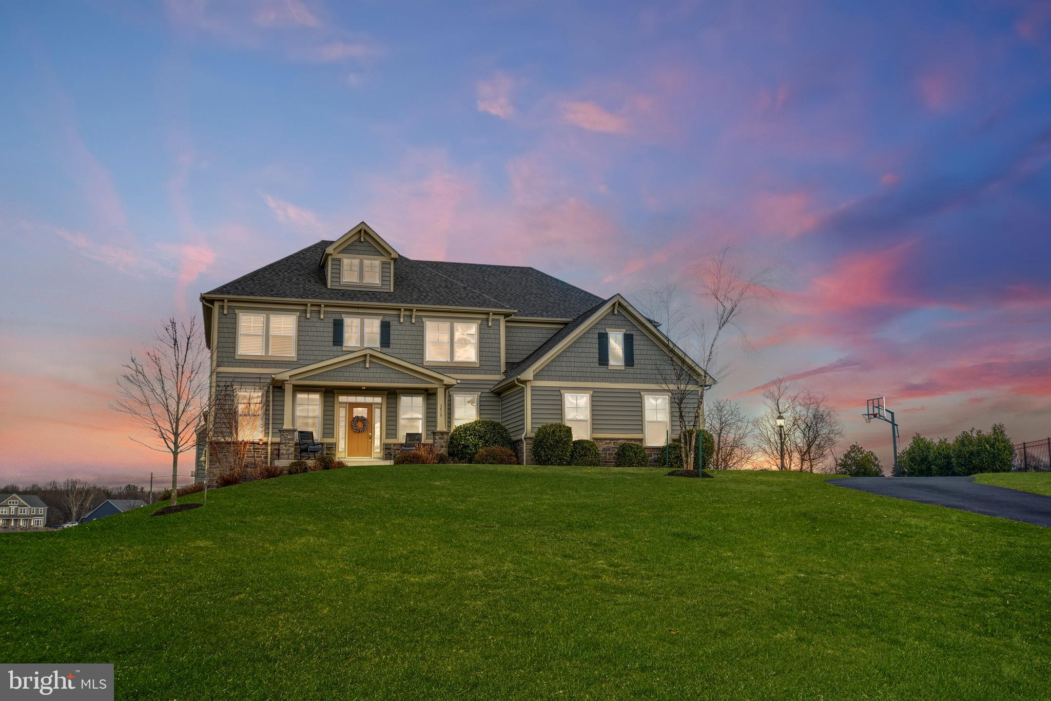 This is a rare opportunity to own a highly sought-after Ash Lawn model in Gladhill Estates! Located in the highly-coveted Urbana High School district, this home is situated on a 2 acre lot with great views and plenty of private space for playing and entertaining! With upgrades throughout--including engineered hardwood floors, and upgraded fixtures and lighting, this lovely home
shows like a model! The modern, open floorplan features great spaces throughout–including a
large office, formal dining room and an expansive family room–great for entertaining around the cozy gas fireplace. Chefs will love cooking in the gourmet kitchen with its granite countertops, loads of light grey shaker-style cabinetry, stainless steel appliances, dual ovens, and large center island/
breakfast bar! The smart, organizational features of this home won’t disappoint! The butler’s pantry/kitchen office center assures that you will never run out of cabinet space! The office center includes a beverage refrigerator, plenty of cabinetry and a built-in desk with room for two. Around the corner, you’ll find the mudroom with custom built-in locker organizers–a convenient feature! And a walk-in coat closet. The main level also includes a light-filled sunroom with a view. Enjoy outdoor living at its best as you walk out from the kitchen/morning room to the fantastic covered porch. Your guests will enjoy relaxing by the stack stone corner fireplace on the deck, too! (pre-wired for mounting your outdoor TV) On the upper level, you will find 5 oversized bedrooms with 3 full bathrooms. The spacious Owner's Suite features a full bump out sitting area--perfect as a quiet space for relaxing with a book or using as another home office space -- plus a spa bath with a large walk-in closet with space for two. The walk-out lower
level is perfect for an in-law or teen suite and includes a full gourmet kitchen with granite
counters and stainless steel appliances. The open floor plan features an eat-in dining area and spacious living area featuring a gas fireplace. The lower level also features a spacious bedroom–with plenty of natural light, an upgraded full bathroom and an enormous walk-in closet. Enjoy your morning coffee
on the expansive two-tiered patio or relax in the hot tub! A white picket fence surrounds a portion of the patio and lawn. Minutes away from commuter routes,
this home is a must-see!