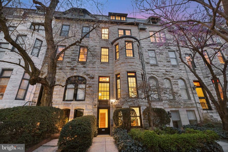 A rare offering in one of the city’s most refined and walkable neighborhoods, Kalorama.  This beautifully upgraded residence blends architectural character, generous proportions, and sophisticated updates across every level. With a handsome stone facade, high ceilings, and expansive room sizes, the home welcomes you with warmth, space, and a strong sense of place. Set on a picturesque block just moments from the Metro, Rock Creek Park, Mitchell Park, and the vibrant farmer’s market, you’ll also find world-class dining, galleries, and shopping at your doorstep—making this a truly exceptional urban sanctuary.

The heart of the home is the sun-filled kitchen that underwent a complete remodel to include custom cabinetry paired with rich stone counters and a textured stone backsplash, a Sub-Zero refrigerator, along with a newer stove and microwave. The breakfast nook overlooks the lush, south-facing back deck—an ideal spot for morning coffee or al fresco dining. Lighting in the kitchen is exceptional, with soft illumination above, below, and within the cabinetry to create a warm and welcoming ambiance, day or night.

Upstairs, the primary suite offers a peaceful retreat, featuring a remodeled, spa-like bathroom thoughtfully designed for comfort and privacy. Additional secondary baths, also fully renovated, maintain the home’s consistent attention to detail. A spacious family room on the next floor up offers the perfect space to relax, with an entertaining bar just steps away—ideal for entertaining or cozy nights in.

The top floor offers a charming bedroom tucked beneath the eaves, with private steps leading to an expansive rooftop deck—an extremely rare and coveted feature. Whether you’re taking in morning light or hosting evening gatherings under the stars, this unique space is a showstopper.

At the entry-level, a private accessory apartment expands the home’s versatility. With its own bedroom, living area, kitchen, and bathroom, this fully independent suite opens to a tranquil, enclosed patio and is perfect for guests, office use, or short-term rental opportunities. Past the gate are two generously sized parking spaces for exceptional daily convenience.    

Beyond its layout and upgrades, the home has benefited from continual, thoughtful improvements. These include the replacement of the garden-level windows (2016), the rooftop deck surface (2021), the slate roof at the front of the house (2024), and both the HVAC system and water heater (2023 and 2024).

From its oversized windows and sun-infused interiors to its generous closet space and seamless indoor-outdoor living, this home offers timeless elegance, modern livability, and unmatched access to everything that makes this neighborhood so desirable.
