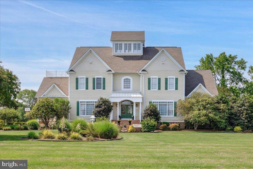 Experience Coastal Luxury at Its Finest! Welcome to South Point's Premier Waterfront Retreat—a showstopping waterfront estate where timeless elegance meets resort-style living. Positioned on 4.88 meticulously landscaped acres, this 5-bedroom, 6-bath custom masterpiece spans nearly 9,000 sq ft and captures unobstructed sunrise views across Sinepuxent Bay to Assateague Island.

A sweeping paver driveway leads to a residence designed with distinction—offering complete privacy, grand entertaining spaces, and refined comfort throughout. Outdoors, indulge in your own private sanctuary featuring an infinity-edge pool with integrated hot tub, a fully equipped summer kitchen, and a lighted pier with boat and jet ski lifts—perfect for unforgettable gatherings or peaceful waterfront relaxation.

Inside, no detail has been overlooked. The gourmet chef’s kitchen boasts custom cabinetry, granite countertops, and dual dishwashers, flanked by formal and casual living areas. A theater room, billiard lounge, wet bar, and home office provide the ultimate in luxury living. The top-level primary suite is a serene escape with a spa-inspired bath, oversized walk-in closet, and private balcony overlooking the bay.

An elevator services all levels for seamless accessibility. Additional features include a 3-car garage with prep kitchen, solar panels, upgraded Wi-Fi speaker system, and an encapsulated crawlspace. This is a rare opportunity to own one of South Point’s most exclusive waterfront estates—where sophistication, comfort, and natural beauty converge.