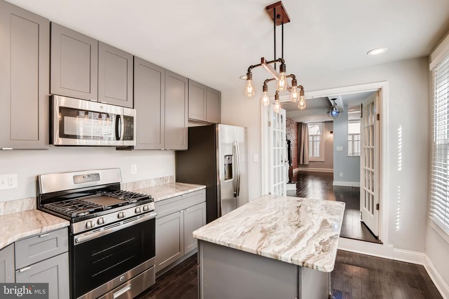 Recently renovated 2 bedroom/2.5 bathroom end-unit row home with PARKING in the heart of Canton! Exposed brick and designer chef's eat-in kitchen with island, upgraded cabinets and granite counters, stainless steel appliances and industrial lighting, plus an eco-burn fireplace in the living room. Gleaming hardwood floors and a half bath on the main level. Upstairs, you'll find two master bedrooms, each with its own full bath! Unfinished basement perfect for storage. Just a couple blocks from O'Donnell Square, this row home is Canton living at its finest! Renter pays all Utilities. Alarm paid until June and then tenant will take over. Gig Stream Internet until the end of year included as well!