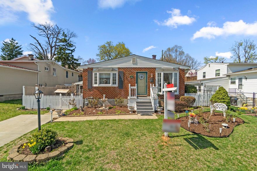 Cheerful curb appeal welcomes you to this 3 bedroom, 2.5 bathroom Catonsville home with more than 1800 square feet of finished living space, complete with a white picket fence, charming lamppost, and carefully edged garden beds that are sure to have you smiling the moment you arrive! Step inside this front-to-back split level to find sunny bay windows and elegant trim in the living and dining rooms, along with a well-planned kitchen featuring granite counters and stainless steel appliances. The upper level includes a spacious primary suite with dual closets and a beautifully renovated full bath. Two additional generously sized bedrooms and a full hall bath with an updated vanity and ceramic surround tub/shower complete the bedroom level. Gather in the lower level family room around the fireplace with brick hearth and wood mantel, custom built-ins, and a bonus room with mini fridge. A workshop, laundry/utility room, powder room, and access to a huge crawl space for additional storage complete the lower level. Sliders from the family room lead to the screened porch with ceiling fan, and the fully fenced rear yard beyond, with a delightful fish pond, pool with deck, shed, and terraced garden beds. Recent updates include a brand new electrical panel (2025), a new pool liner (2022), and replacement HVAC (2021). In the heart of Catonsville’s Paradise area, and just a few steps to the picturesque Catonsville Short Line Trail, this home offers unbeatable access to 695, 195, and 95, plus nearby MARC train service and BWI Airport. Commuting to Fort Meade, NSA, Columbia, or downtown Baltimore is a breeze. This Catonsville dream home checks every box - cul de sac location, spacious layout, walkout lower level, screened porch, sparkling pool - and it’s priced to make your next move a reality!
