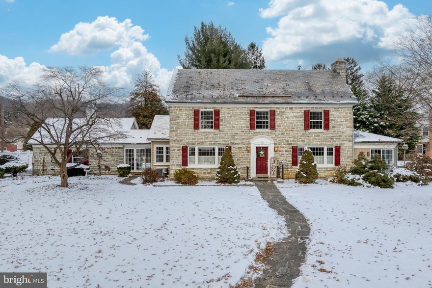 This center hall Colonial says "Welcome" and boasts a generous 3,328 sq ft.! With timeless charm and appeal, spacious rooms, and a flowing design, you'll really appreciate the warmth, and welcoming feel. It has been lovingly owned and maintained with pride.
 
You are greeted by the center foyer, which provides direct access to each area of the home. The living room is open and inviting with crown molding, wainscoting, a fireplace and beautiful hardwood floors. Or escape to the adjoining sunroom for a quieter space. The formal dining room has an air of gracious elegance with wainscoting and hardwood, plus there is direct access to the updated kitchen. The lovely kitchen offers raised panel cabinets, granite countertop, tile backsplash, an island, and a cozy breakfast nook. And the enclosed breezeway joins the garage for added convenience. The main level also features a tranquil den to the rear of the home and a convenient half bath.

Upstairs each of the 3 bedrooms are nice-sized with ample closet space. The primary bedroom suite has a walk-in closet, a private bathroom with tile floor, granite top vanity and soaking tub/shower. The 3rd level is an awesome attic with a cedar closet to help keep your household organized. 

The lower level also offers an inviting family room with new carpet and a comfy-cozy fireplace. There is also a large workshop, and several storage rooms.      

This one of a kind home sits on a lovely corner lot with circular driveway, 2 car garage, ample off street and on street parking. You'll enjoy the stamped concrete rear patio with fish pond, the perfect spot for morning coffee or evenings to relax.  

Don't miss seeing this one and all of the beautiful finishing touches that make this house a home!