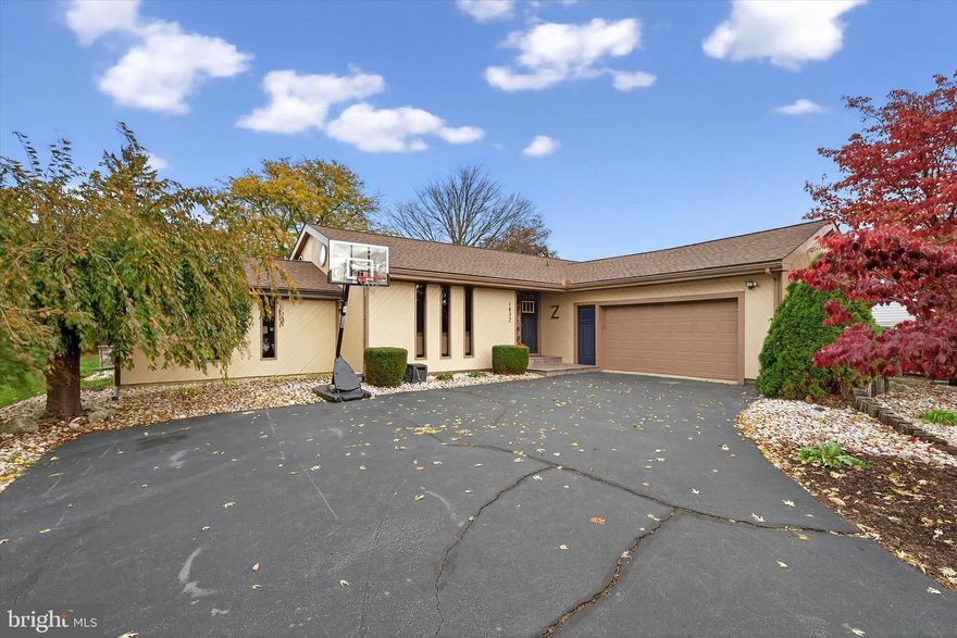 Offer deadline of Tuesday, November 4th at 8pm.  

Come and see this warm and welcoming rancher in Mount Joy. Built in 1976, it is filled with
unique architectural details: spiral staircase, tall windows and skylights, high ceilings and
exposed wood beams. Set on 0.36 acres of land, you will have all the indoor and outdoor living
space you could desire. As you step through the front door, the living room welcomes you with
lofted ceilings and floods of natural light. Upper circular windows allow in additional light, and
French doors lead to a gorgeous family room. The openness between the living room and family
makes hosting simple. Or close the doors to escape to a quiet retreat. The newly installed
skylights and natural wood details of the family room create a warm and inviting space to curl up
with a good book or host a movie night with loved ones.
Beyond the living room is the dining room and kitchen, where the lofted ceilings and natural
wood beams continue, creating a cohesive and elevated effect. Hardwood cabinetry, stainless
steel appliances, and acres of countertop give you a kitchen that will inspire your inner chef. A
coffee bar area adds even more storage and workspace. The kitchen opens to the dining room,
ideal for hosting large holiday meals or intimate soirees. Complete with contemporary lighting,
warm wood flooring, and a sliding door to the back deck area, the space is beautiful and versatile
and made for gathering indoors or out.
Down the hall from the dining room are 3 bedrooms and a full bathroom. The primary bedroom
has a tasteful accent wall and a recently updated ensuite bathroom with walk-in shower, built-in
storage, new flooring, and contemporary vanity.  The 2 additional bedrooms are bright and airy, with plush carpets, large closets, and natural light. The full bathroom is newly updated and has a large vanity with a tub and shower combination. These rooms promise space and comfort for everyone.
Downstairs is the fully finished basement. Descend into a large rec room, where you’ll find a
wood stove and new flooring. An additional finished room can be used for anything you need: a
home office, a play room, a home studio, or a crafting space. A large, discrete storage area and
laundry room complete the lower level. A second staircase leads up to the attached 2-car garage
for easy accessibility to the downstairs from both sides of the home.
There is just as much outdoor living as there is indoors. In addition to the back deck, there is a
beautiful stone patio with a built-in firepit - the perfect setting for cooler evenings. A new shed
can be found in the backyard, along with loads of space for that garden you’ve always dreamed
of planting. Additional upgrades to the home include a new roof (2024) and all new plumbing
(2025). Situated in a quiet, welcoming neighborhood, this gorgeous, well-maintained home is
just waiting for you to come and make it yours.