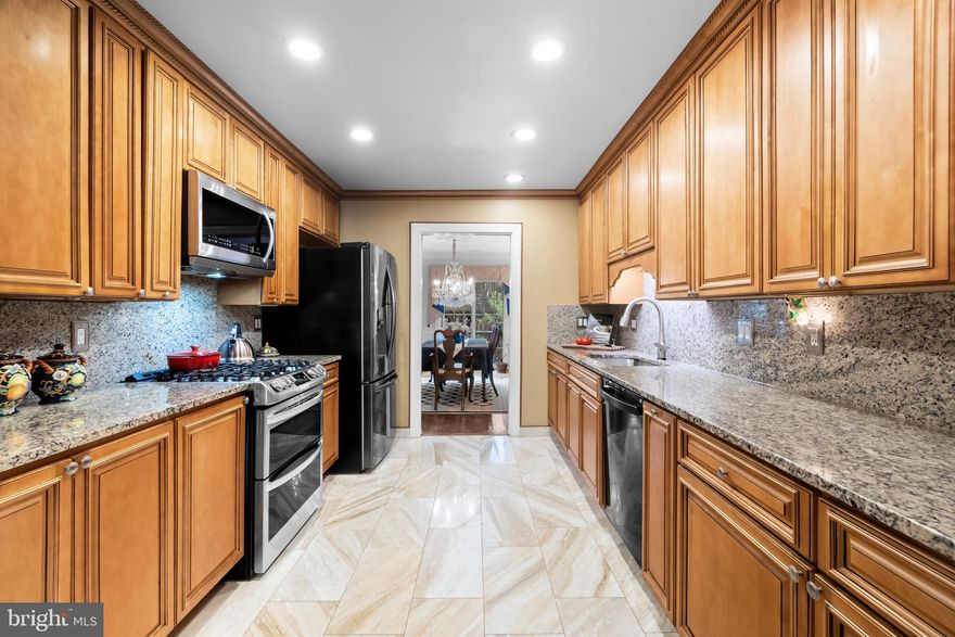 Welcome to 6303 Chaucer Lane, a nicely upgraded 3 bedroom, 3 full/2 half bath, 1-car garage TH with 2992 finished sq.ft.  This TH is in the Landmark Mews community located at the West End of Alexandria. The Community offers a Park-like setting, while still providing immediate access to 395/Beltway/95, with proximity to the Pentagon, DC, Reagan National airport, and Old Town Alexandria.  Landmark Mews is 5 minutes from the $2.2 Billion WestEnd Alexandria development project, which will include the new Inova Alexandria Hospital Campus.  This combination of house, Community, and location features are rarely found Inside the Beltway.  XXXXX  To learn more about Landmark Mews, check out the Listing Agent's Living in Landmark Mews website.  If you are viewing the non-branded version of this Property website, ask your agent for the URLs to both the branded Property website (for the Community and WestEnd Alexandria project videos) and the Living in Landmark Mews website, which is a comprehensive source of visuals and information on choosing the Community as your Home.  The Landmark Mews website also includes the referenced Community video with spectacular aerial views and videos/info on restaurants, shopping, and other "Livability" benefits from proximity to everything.  XXXXX  House Features & Upgrades:  This four-level home has upgrades throughout, both inside and exterior, which make this house truly move-in ready to enjoy as your new home.  A curved brick walk leads to this brick front TH, with mature landscaping and Carriage lights flanking the solid wood front door providing visual appeal.  From the front door you are a 30-second walk to the 1-acre central Commons in the Community with walking paths, benches, and mature trees and landscaping.  The home opens to a tiled entry with a 12-foot ceiling, then on to the fully remodeled kitchen with added cabinets, granite counters & backsplash, and stainless appliances.  The Living and Dining Rooms on the Main Level have wood floors, with a wood burning fireplace.  The fenced patio is accessed from the Main Level through a sllder door to a landing with metal railings.  The patio also includes a built-in water feature.  The half bath on the Main Level has been fully remodeled.  The stairs and bedroom level floors are also hardwood.  The bedroom level has two Owner's Suites, each sized to make a King bed look small.  Both bedrooms have en suite bathrooms with a large walk-in closet.  The 1st Owner's Suite has a remodeled bathroom with a frameless glass shower door and built-in cabinetry for additional storage.  The Upper Level has the 3rd bedroom, with a walk-in closet.  The 3rd full bathroom serves this bedroom.  This level has two large walk-in attic storage spaces.
The Lower Level has the 2nd wood burning fireplace, a bar with granite top and beverage cooler, an upgraded 2nd half bath, & the laundry room.  This level has a walk-in storage area.  All light fixtures in the house have been upgraded.  All house windows are replacement windows with dual tilt-in sashes.  The house has a central vacuum system.  Lutron Caseta Smart light switches for all Main Level and staircase lighting.  All door hardware in the home is Baldwin Carnaby series.  HVAC systems are 2013 and 2021.  New water heater in 2021.  Roof replaced in/around 2010.  XXXXX  Landmark Mews is a community of 148 townhouses that surrounds a 1-acre central Commons.  This Park setting created by the Commons, mature trees, brick walls, and lush landscaping is rare for a community located Inside the Beltway.  Landmark Mews is also only 13 miles from Washington, DC, with immediate access to 395/Beltway/95, and offers the Livability benefits from its location at the West End of Alexandria. ​Dining, shopping, recreational, and cultural options found in Washington DC, Old Town Alexandria, Arlington, Shirlington, Mosaic, and Tysons are within easy reach.