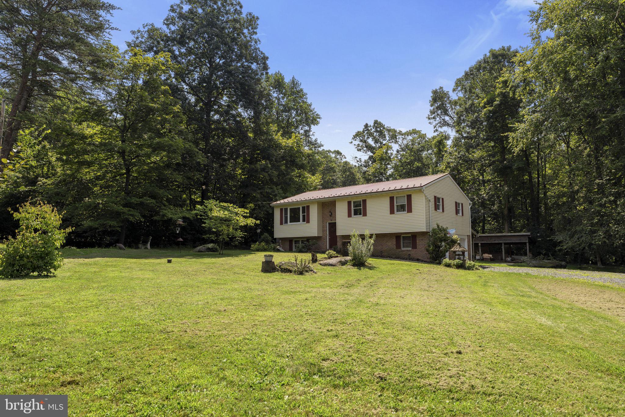 AUCTION DATE - MONDAY, SEPTEMBER 8, 2025 AT 4PM. LISTED PRICE IS AN OPENING BID ONLY AND IS NOT INDICATIVE OF THE FINAL SALE PRICE. REAL ESTATE: Split foyer dwl. w/1824 SF finished area, eat-in kitchen w/custom oak raised panel cabinets & appliances, living rm. w/picture window, 3 bdrms., 1½ baths, 1st floor laundry, lower level family rm. w/pellet stove, electric baseboard heat, screened in covered deck & 2 car garage all on 1.39 ACRE partially wooded lot w/on-site well & septic. NOTE: Owner moving to smaller quarters & is motivated to sell. Ideally located along quiet country road. Convenient location, minutes to Bowmansville, Adamstown & Sinking Spring w/easy access to Rts. 625, 272/568, 222 bypass & Turnpike. Terms 10% down, balance 60 days or before. Personal inspection by appointment or open house Sat., August 30 & September 6 from 1 to 4 PM.