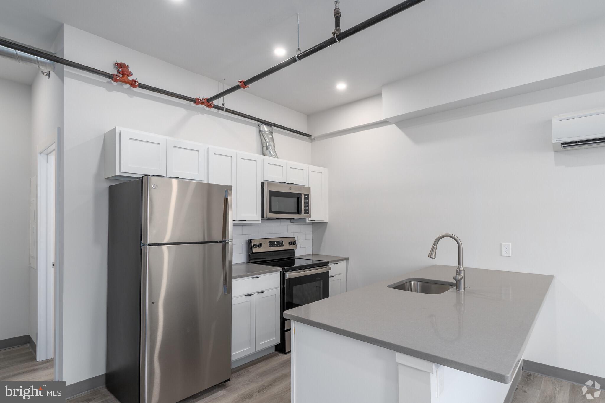 This new property is in the center of town, but two blocks removed from the busyness of Bridge Street. Onsite parking is available and these units are basically brand new. This former commercial building underwent a full conversion to apartments in 2022-2023 and was transformed into Phoenixville's newest boutique apartment building.
Unique setup in that every unit has its own exterior access either at grade level or from the catwalk. There are no shared hallways to walk through. The upper level units have dramatic high ceilings with loft storage space available as well.
All units have brand new and modern finishes, 4 piece kitchen appliance package, Quartz countertops, air conditioning, washer/dryers in the unit, Smart features, fire alarm, sprinkler systems and high ceilings. There is parking available for an additional monthly fee of $55. Don't pay for amenities elsewhere that you can't or won't use and come make this your new home in Phoenixville! (Photos are representative of all unit finishes but may not be the exact unit available).
