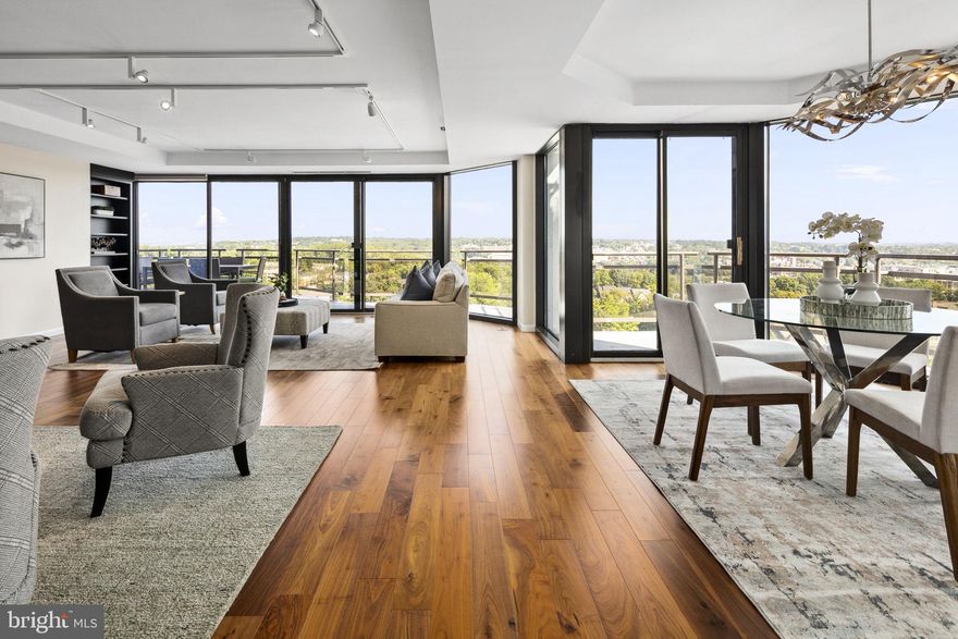 This is unit 1112 and 1115 combined. Step into this stunning, reimagined condominium at the Atrium Residences. Spanning 2,785 sq. ft., this expansive corner-unit home offers a seamless blend of modern design and breathtaking views that define upscale living. Bask in the sweeping, unobstructed views of the National Cathedral, Georgetown University, and the Key Bridge, while enjoying the beauty of sunrises and sunsets from any of the five magnificent balconies. The open living room, designed with floor-to-ceiling glass walls, welcomes natural light and showcases spectacular cityscapes, making the space perfect for both entertaining and serene relaxation. A family room is the perfect spot for a television and reading with a wall of custom built-ins. The state-of-the-art kitchen features high-end appliances and custom cabinetry and has pass through openings to the dining room creating a chef’s dream. The condo offers a thoughtfully designed floorplan, including a first bedroom/office facing east for inspiring sunrises, and third and fourth bedrooms or den spaces nestled in the north/west corridor for tranquil evenings. The master suite serves as a private retreat with expansive views, a dressing room, and an elegant ensuite bathroom equipped with premium fixtures and finishes. The custom designed butler’s pantry includes two temperature-controlled wine coolers, glass cabinetry for stemware and loads of storage.  A laundry room to die for has been outfitted with cabinetry and countertops, drying racks, a tv and beverage refrigerator. This property has ample storage in unit and includes two additional storage units on the main level of the building. The residents of this home enjoy access to exclusive amenities, including a fitness center, pool, tennis and pickleball courts, a dry cleaner, 24-hour concierge services, and three secure parking spaces. Situated in Rosslyn Heights, looking down on Rosslyn, the condominium offers easy access to dining, shopping, and cultural attractions, while maintaining a serene, private environment.