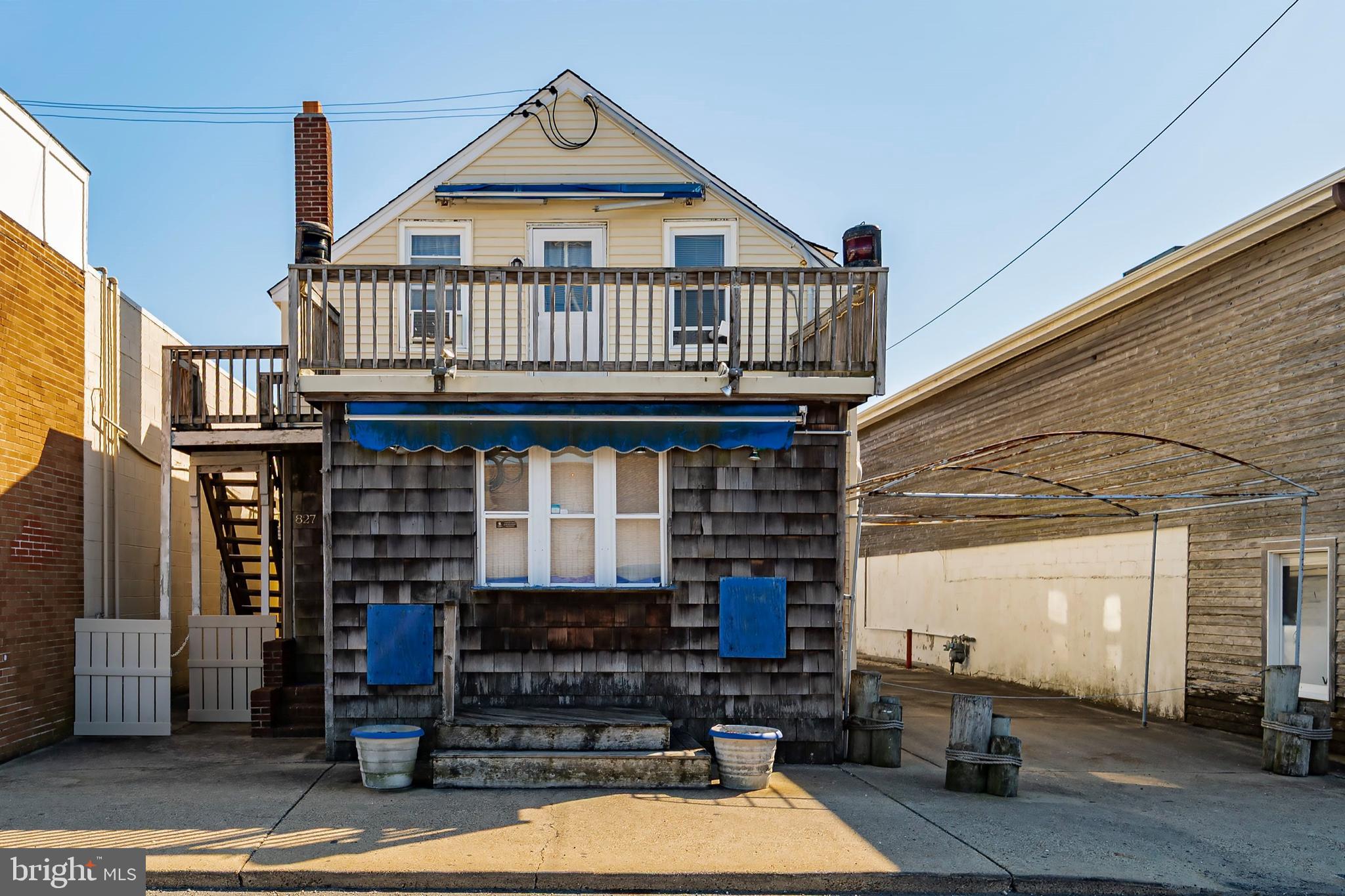 Charming vintage building and ideal commercial opportunity in the heart of Long Beach Island's premier retail spot in Beach Haven/Bay Village area! Just steps to the ocean, Fantasy Island, Thundering Surf Water Park, shops, restaurants, and more! This old-fashioned gem features cozy sleeping quarters (currently used as 4 bedrooms, 2 baths), and a spacious backyard. Carry on the beloved tradition of the Chowder Hut or embark on a new business venture with living space included. An eclectic and unique space full of character—a true bijou by the sea!