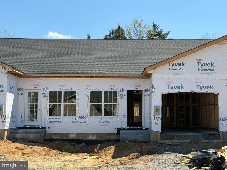New construction quadplex unit in desirable Woodstock, VA, just a short drive from Seven Bends State Park’s outdoor recreation along the North Fork of the Shenandoah River, including hiking, picnicking, fishing and scenic views. This unit features 2 bedrooms, 2 full baths, a versatile den, and an attached one-car garage. The well-planned layout offers low-maintenance living with modern finishes, an open living space, and generously sized bedrooms, and the den provides flexible use as a home office or additional living area. Ideal for those seeking new construction near both town amenities and world-class outdoor access. Real estate taxes currently shown do not reflect a home built on the property.