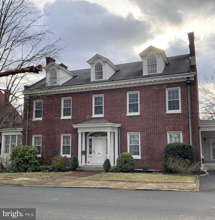 Beautiful 3-story brick home on Washington St. featuring panoramic views of the city.  Upon entering, you will be welcomed by a gracious foyer with wide open staircase.  The first floor as features a living room, formal dining room, kitchen w/ granite countertops, a breakfast room with a coffee bar and an area with a separate entrance perfect of a home office.  On the second floor, there is a large master suite with soaking tub and sitting area, 2 additional bedrooms and another full bathroom.  The second floor also features a  sunroom, which would be ideal for a studio or playroom. Extensive natural light throughout the home.  The lower level features an in-law suite with  its own private entrance and patio. Private rear yard. The list goes on!